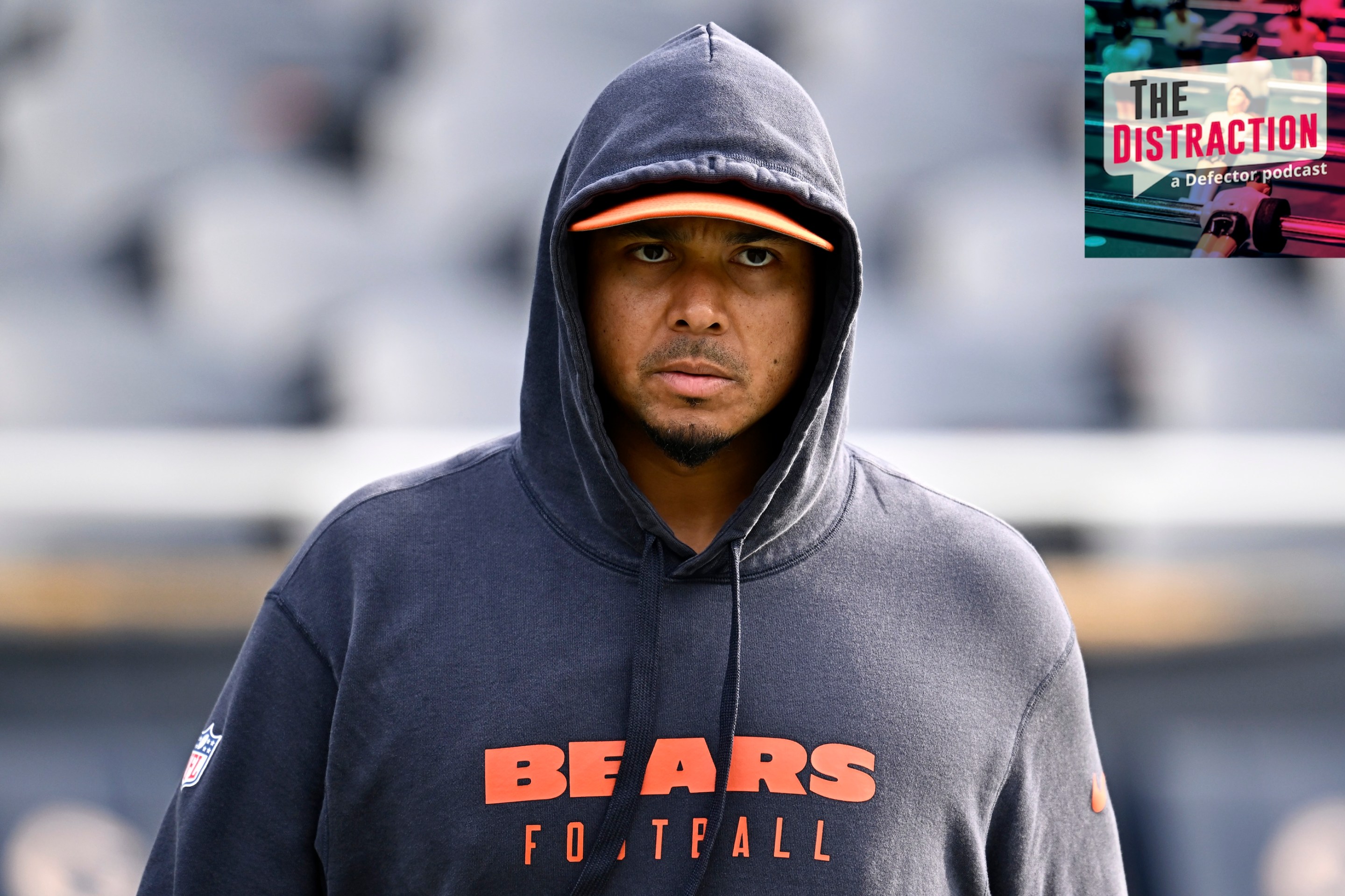 General manager Ryan Poles of the Chicago Bears looks on prior to a game against the Green Bay Packers at Soldier Field on November 17, 2024. He is scowling under a hoodie.