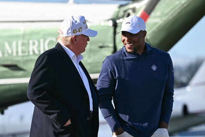 US President Donald Trump (L) walks with Philadelphia Eagles running back Saquon Barkley before boarding Air Force One Morristown Municipal Airport in Morristown, New Jersey, on April 27, 2025. Trump is returning to Washington, DC, from his residence in Bedminster, New Jersey, after traveling to Rome for the funeral of Pope Francis.