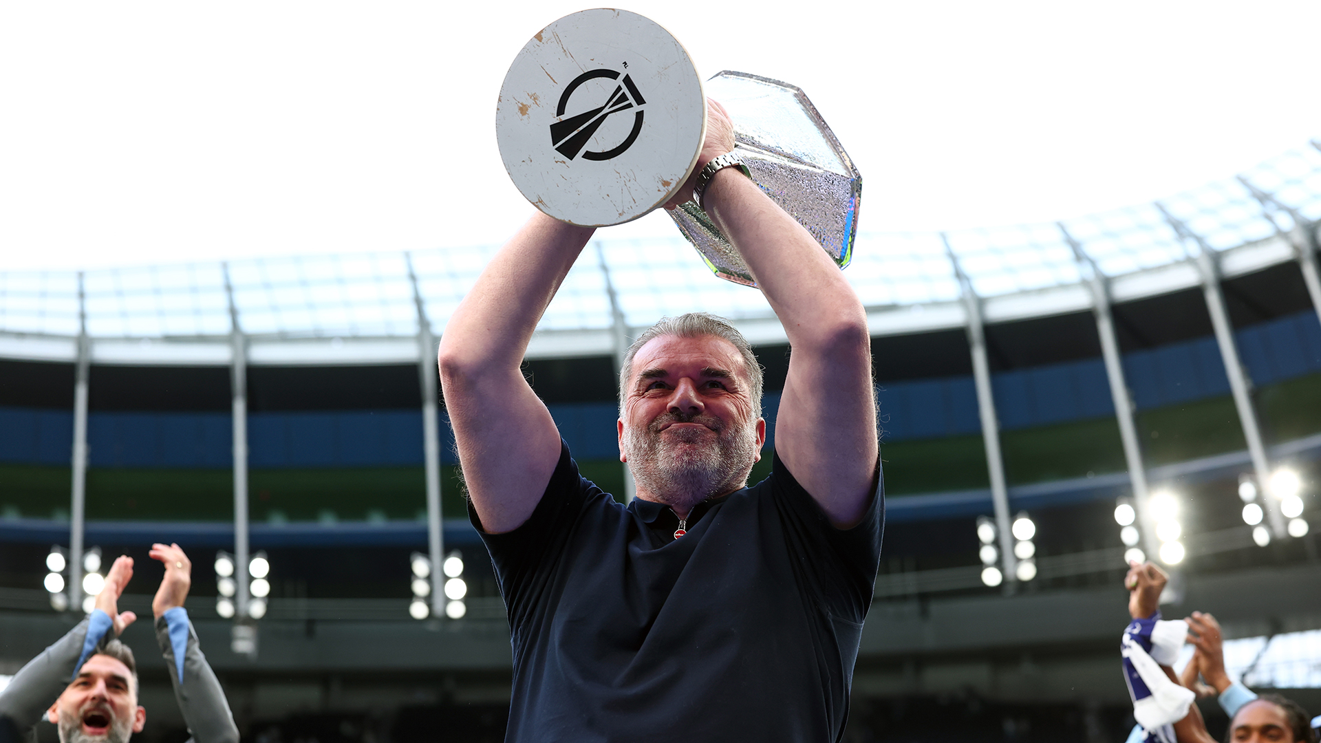 Tottenham Hotspur Manager Ange Postecoglou celebrates with the UEFA Europa league trophy during the Premier League match between Tottenham Hotspur FC and Brighton &amp; Hove Albion FC at Tottenham Hotspur Stadium on May 25, 2025 in London, England.