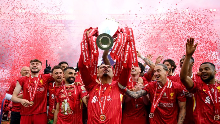 Virgil van Dijk of Liverpool, lifts the Premier League trophy, as Liverpool are crowned the Champions of the Premier League for the 2024/25 Season, following the Premier League match between Liverpool FC and Crystal Palace FC at Anfield on May 25, 2025 in Liverpool, England.