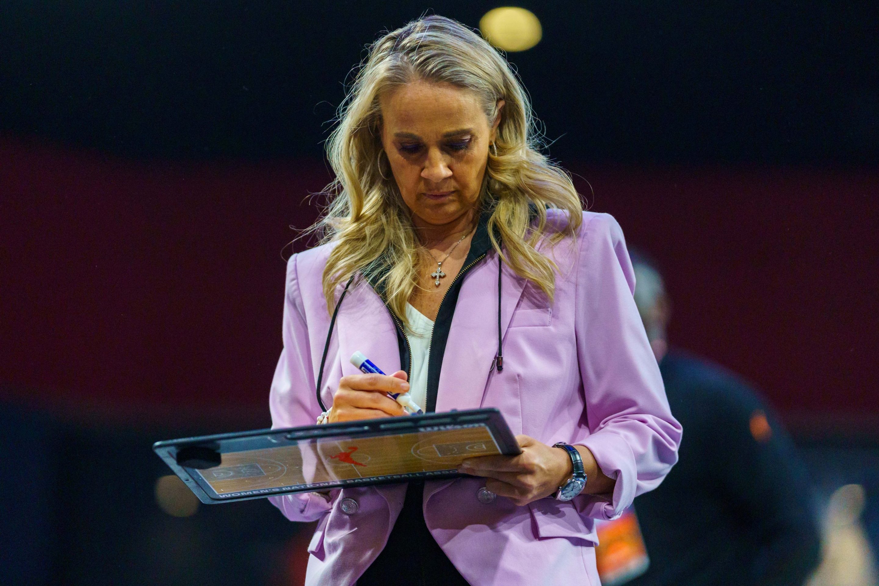 Head coach Becky Hammon of Las Vegas Aces draws a play during a game between the Las Vegas Aces and Atlanta Dream