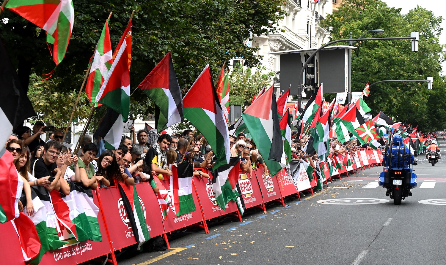 BILBAO, SPAIN - SEPTEMBER 03: A group of fans protest against Team Israel - Premier Tech riders by displaying Palestinian flags at arrival during the La Vuelta - 80th Tour of Spain 2025, Stage 11 a 157.4km stage from Bilbao to Bilbao / #UCIWT / on September 03, 2025 in Bilbao, Spain. (Photo by Dario Belingheri/Getty Images)