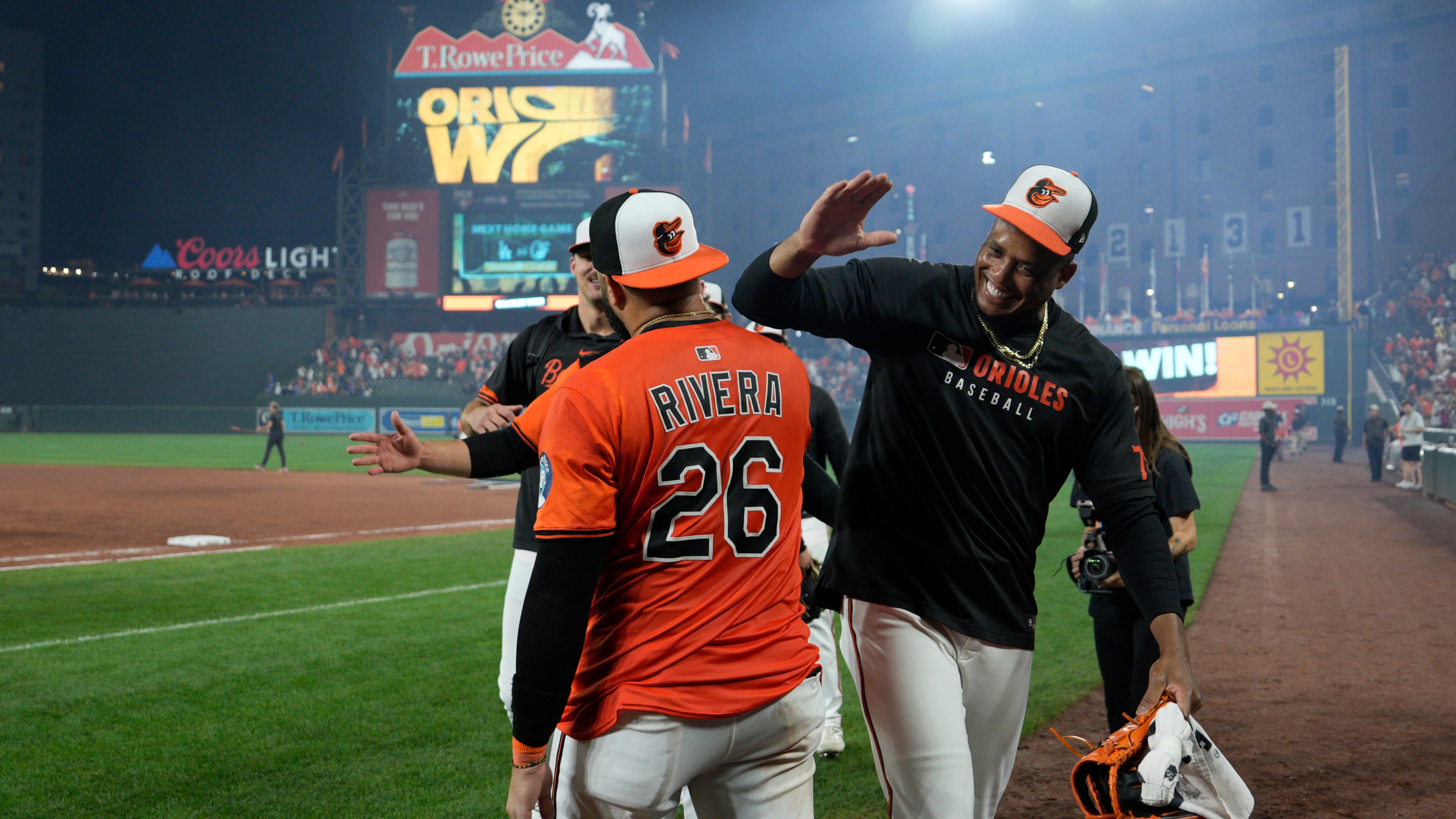 Emmanuel Rivera #26 of the Baltimore Orioles celebrates with teammates after walking off the Los Angeles Dodgers 4-3 at Oriole Park at Camden Yards on September 06, 2025 in Baltimore, Maryland