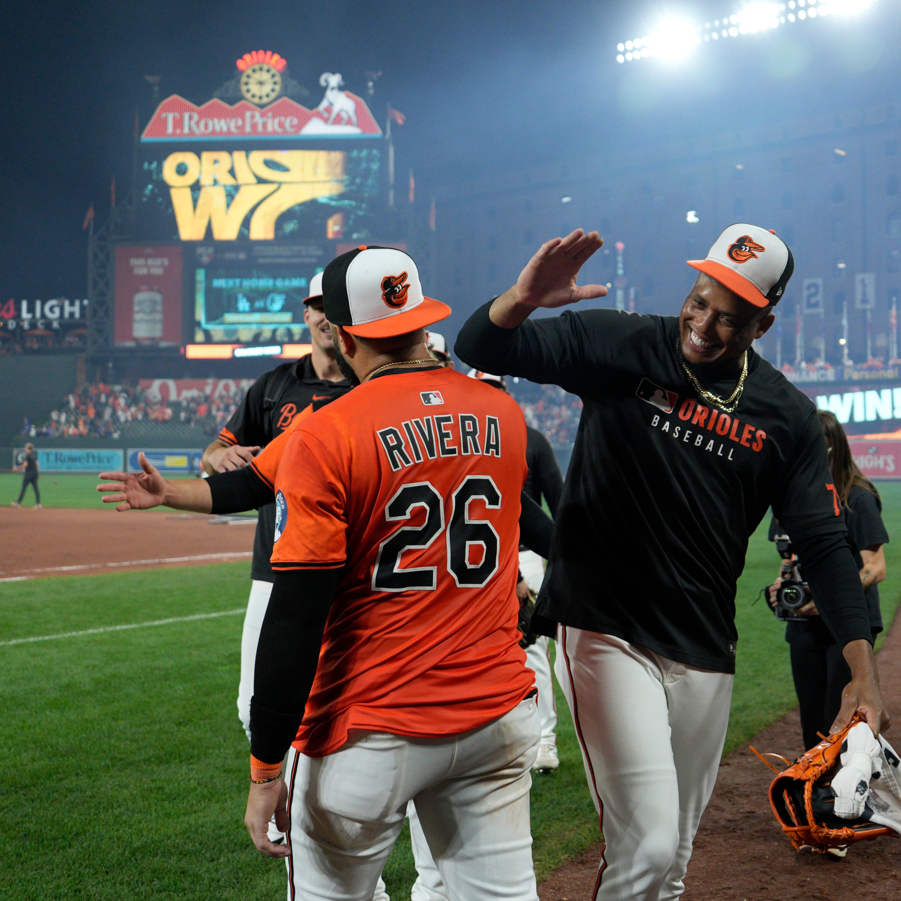 Emmanuel Rivera #26 of the Baltimore Orioles celebrates with teammates after walking off the Los Angeles Dodgers 4-3 at Oriole Park at Camden Yards on September 06, 2025 in Baltimore, Maryland