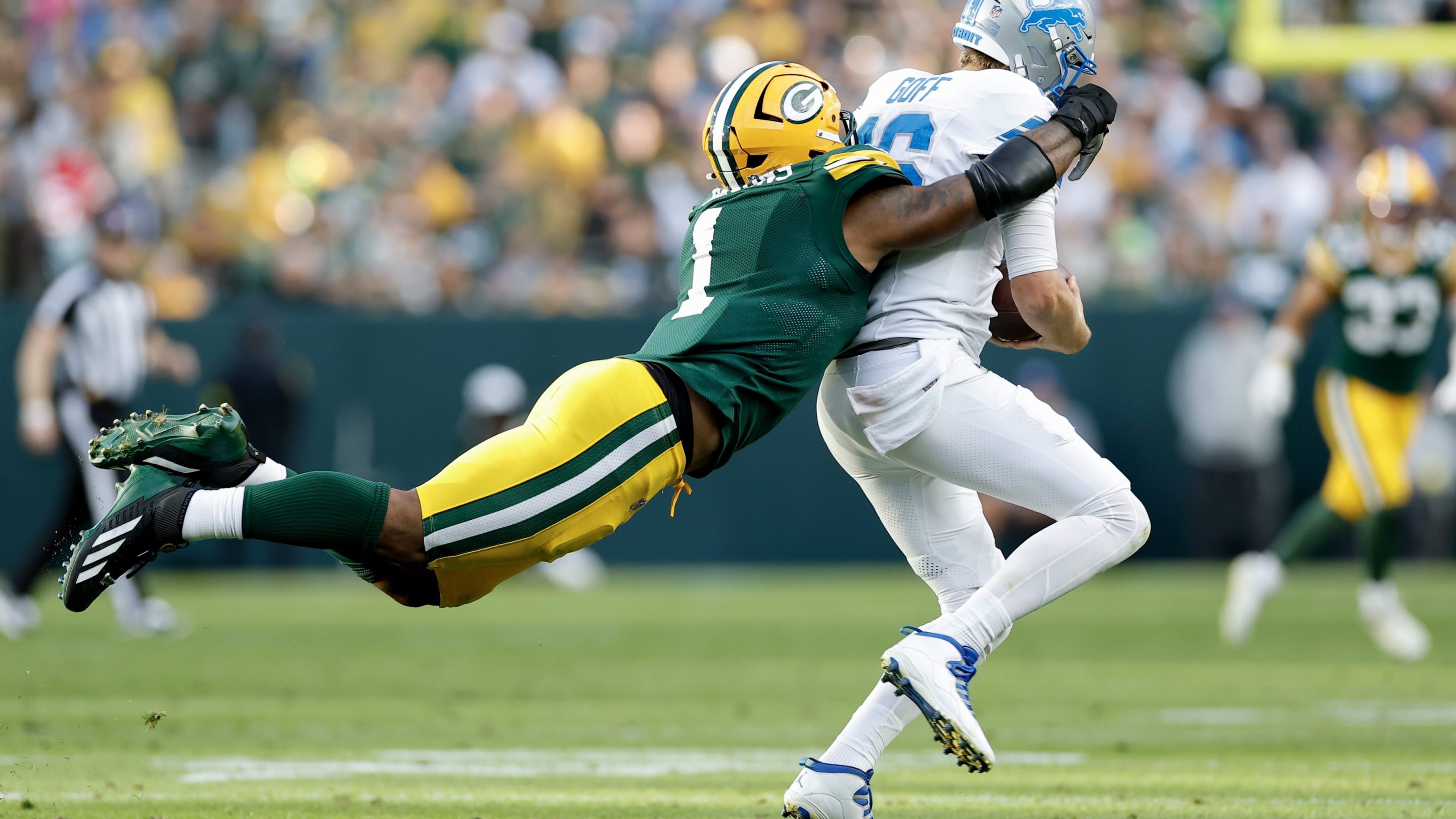 Micah Parsons #1 of the Green Bay Packers sacks Jared Goff