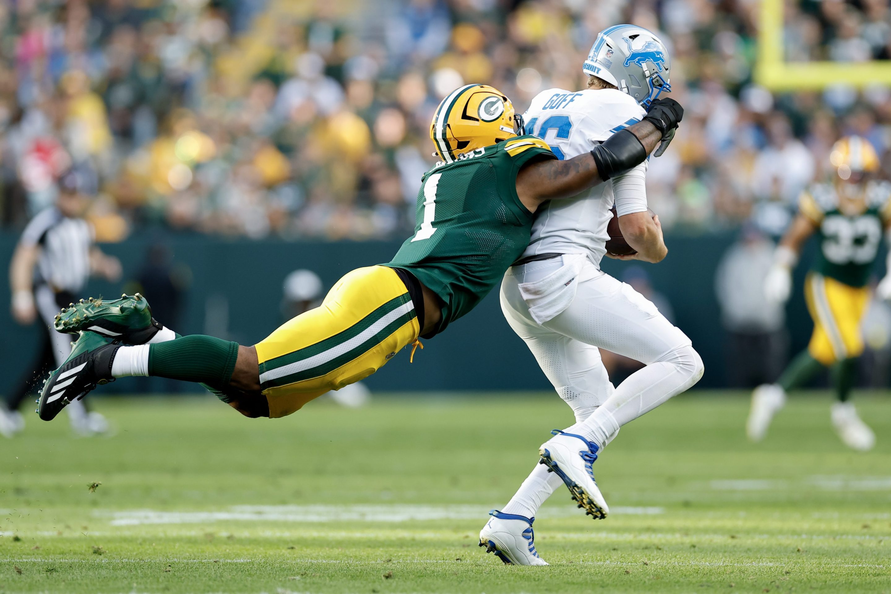 Micah Parsons #1 of the Green Bay Packers sacks Jared Goff