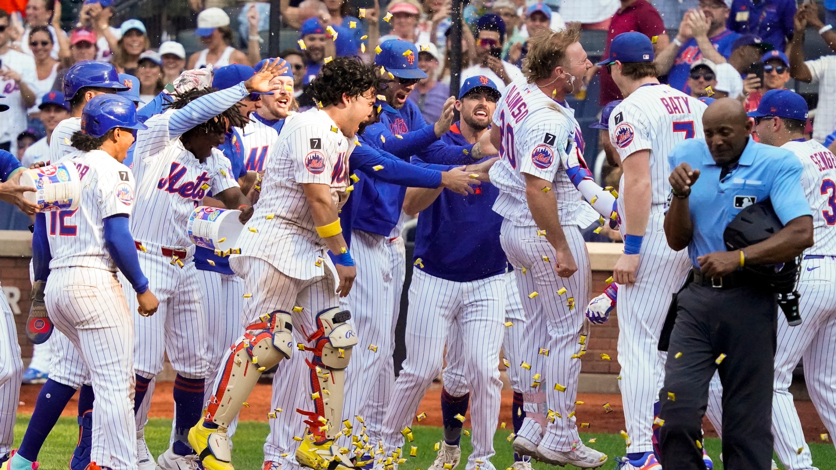 of the New York Mets heads to home plate to celebrate with teammates after hitting a home run for a walk off win in the bottom of the 10th against the Texas Rangers at Citi Field on September 14, 2025.