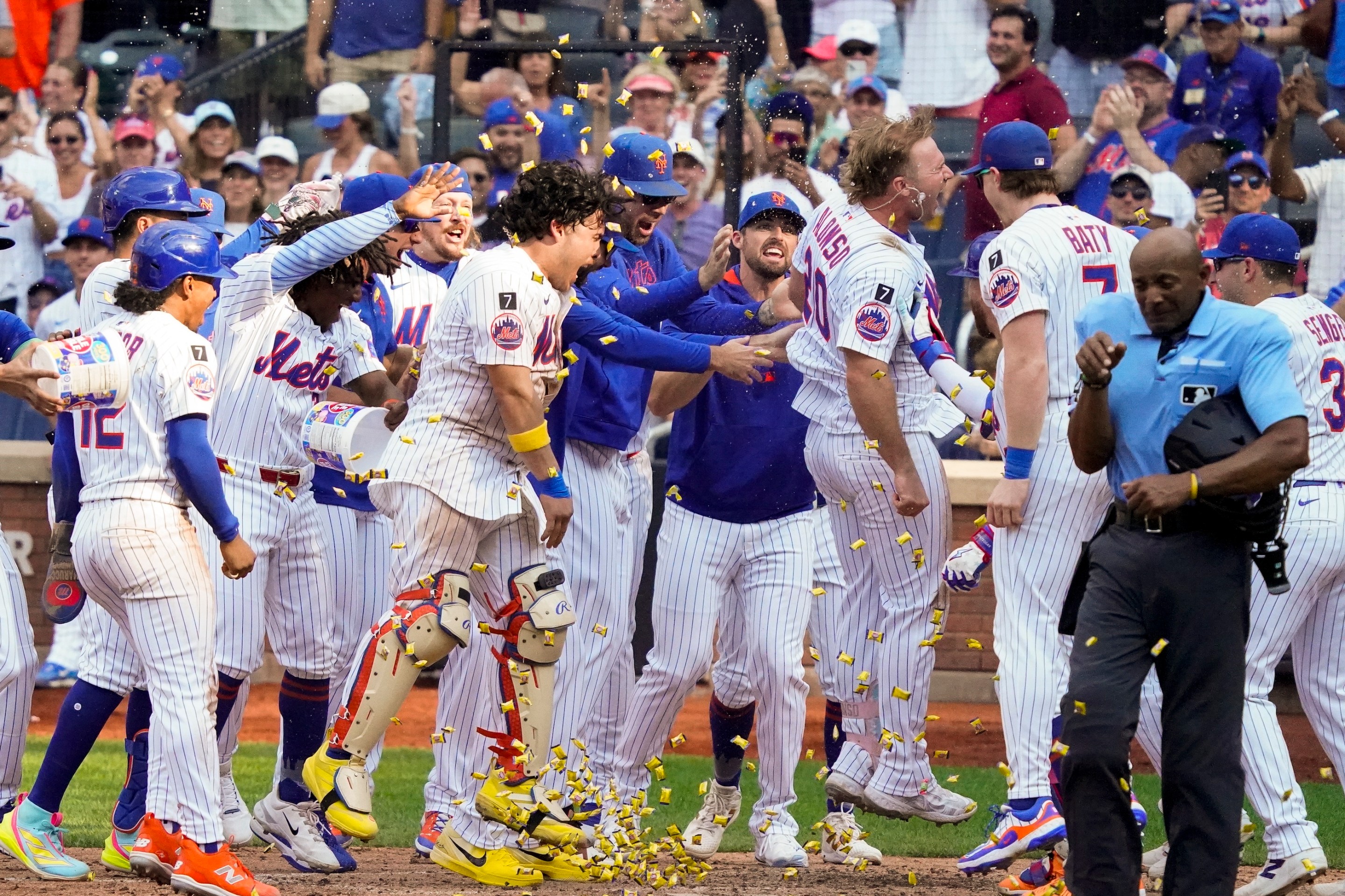 of the New York Mets heads to home plate to celebrate with teammates after hitting a home run for a walk off win in the bottom of the 10th against the Texas Rangers at Citi Field on September 14, 2025.