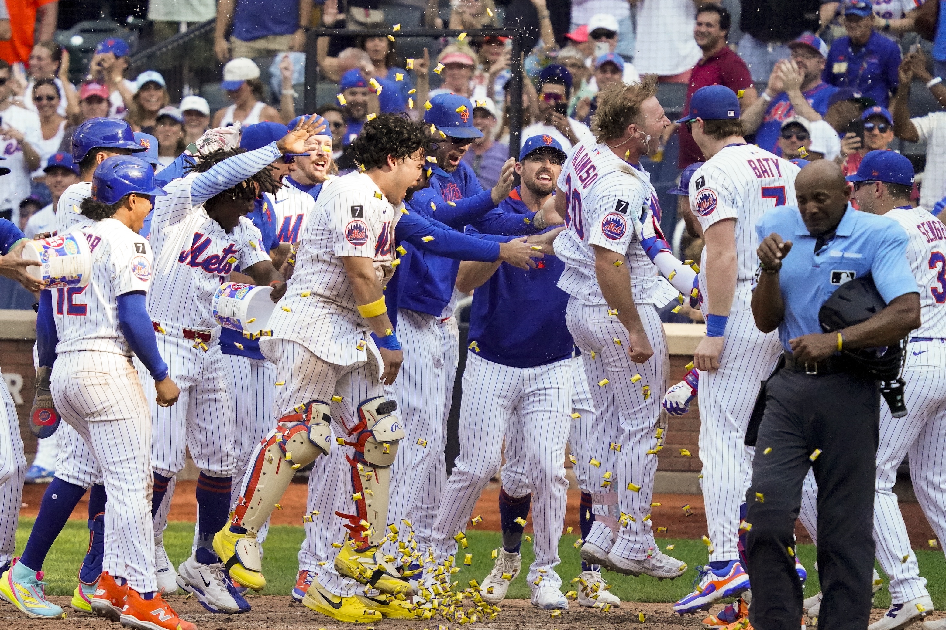 of the New York Mets heads to home plate to celebrate with teammates after hitting a home run for a walk off win in the bottom of the 10th against the Texas Rangers at Citi Field on September 14, 2025.