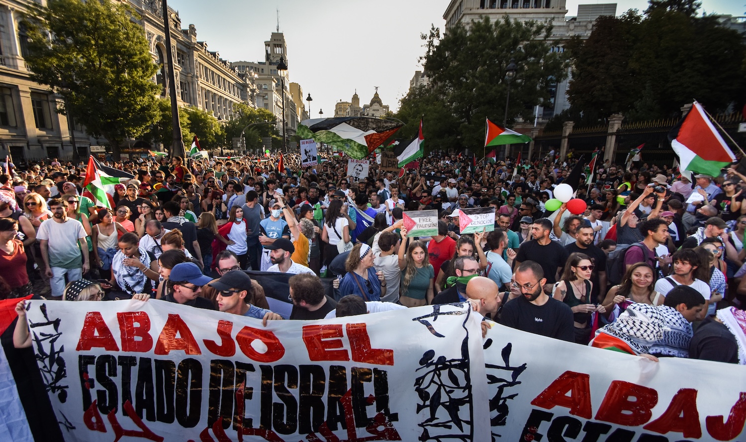 On September 14, 2025, in Madrid, Spain, the Vuelta a Espana comes to an unprecedented halt as the final stage is canceled with 56 km to go due to large-scale pro-Palestinian protests in the heart of the Spanish capital. Despite a massive deployment of around 1,500 officers, demonstrators break through police barriers at Cibeles, chant ''Free Palestine,'' and block the race circuit. For security reasons, several pro-Israel sympathizers are escorted away from the area by Policia Nacional to prevent direct clashes. (Photo by Francesco Militello Mirto/NurPhoto)