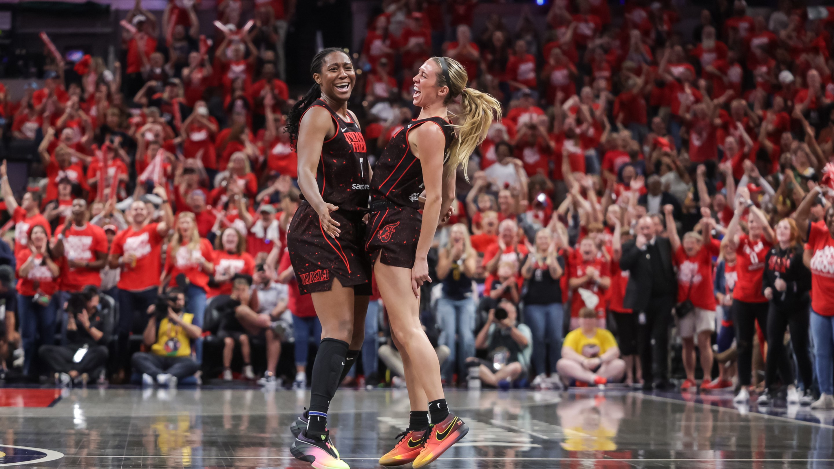 Aliyah Boston #7 and Lexie Hull #10 of the Indiana Fever celebrate during the second half against the Atlanta Dream in game two of the first round of WNBA Playoffs at Gainbridge Fieldhouse on September 16, 2025 in Indianapolis, Indiana.