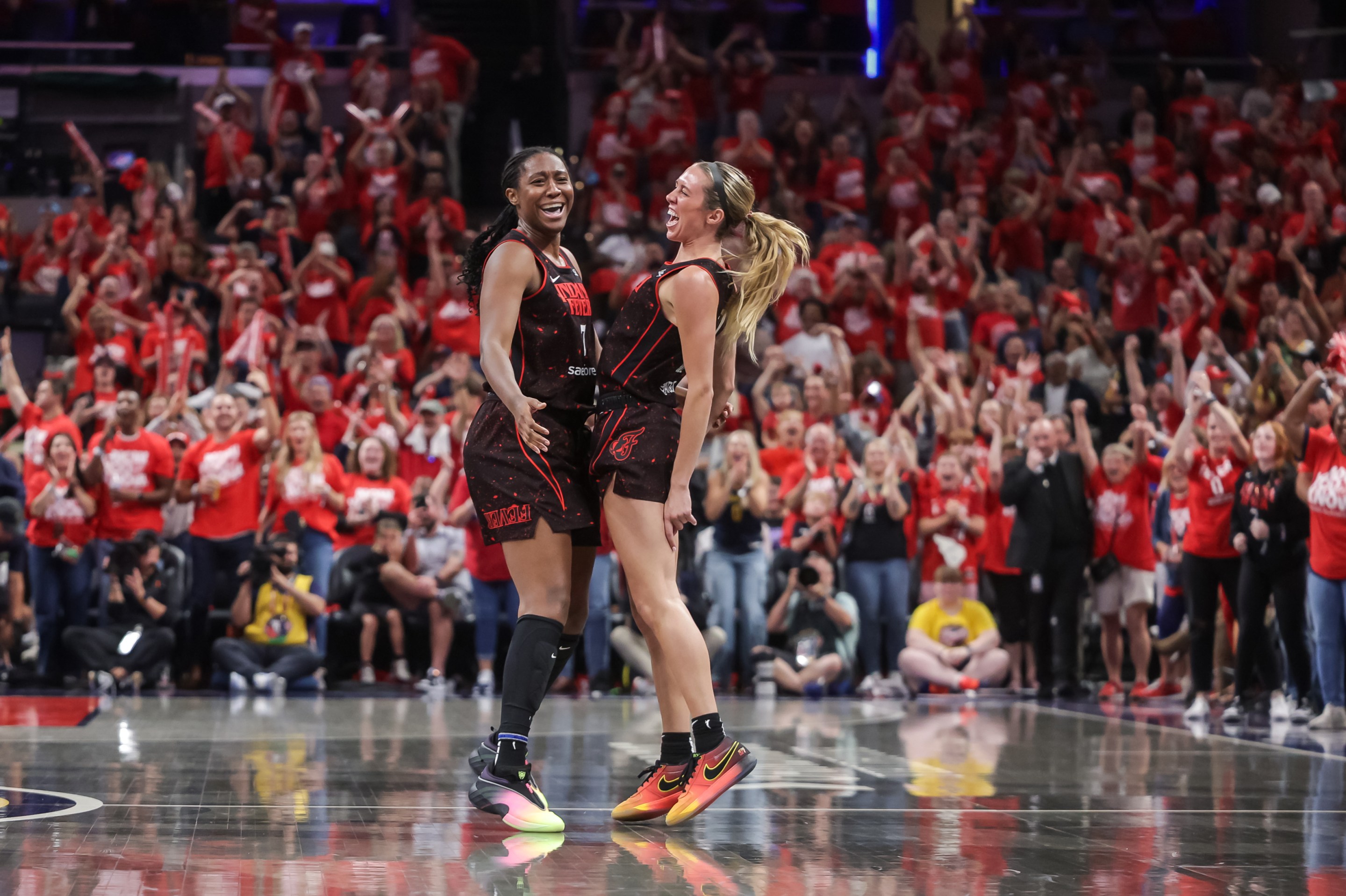 Aliyah Boston #7 and Lexie Hull #10 of the Indiana Fever celebrate during the second half against the Atlanta Dream in game two of the first round of WNBA Playoffs at Gainbridge Fieldhouse on September 16, 2025 in Indianapolis, Indiana.