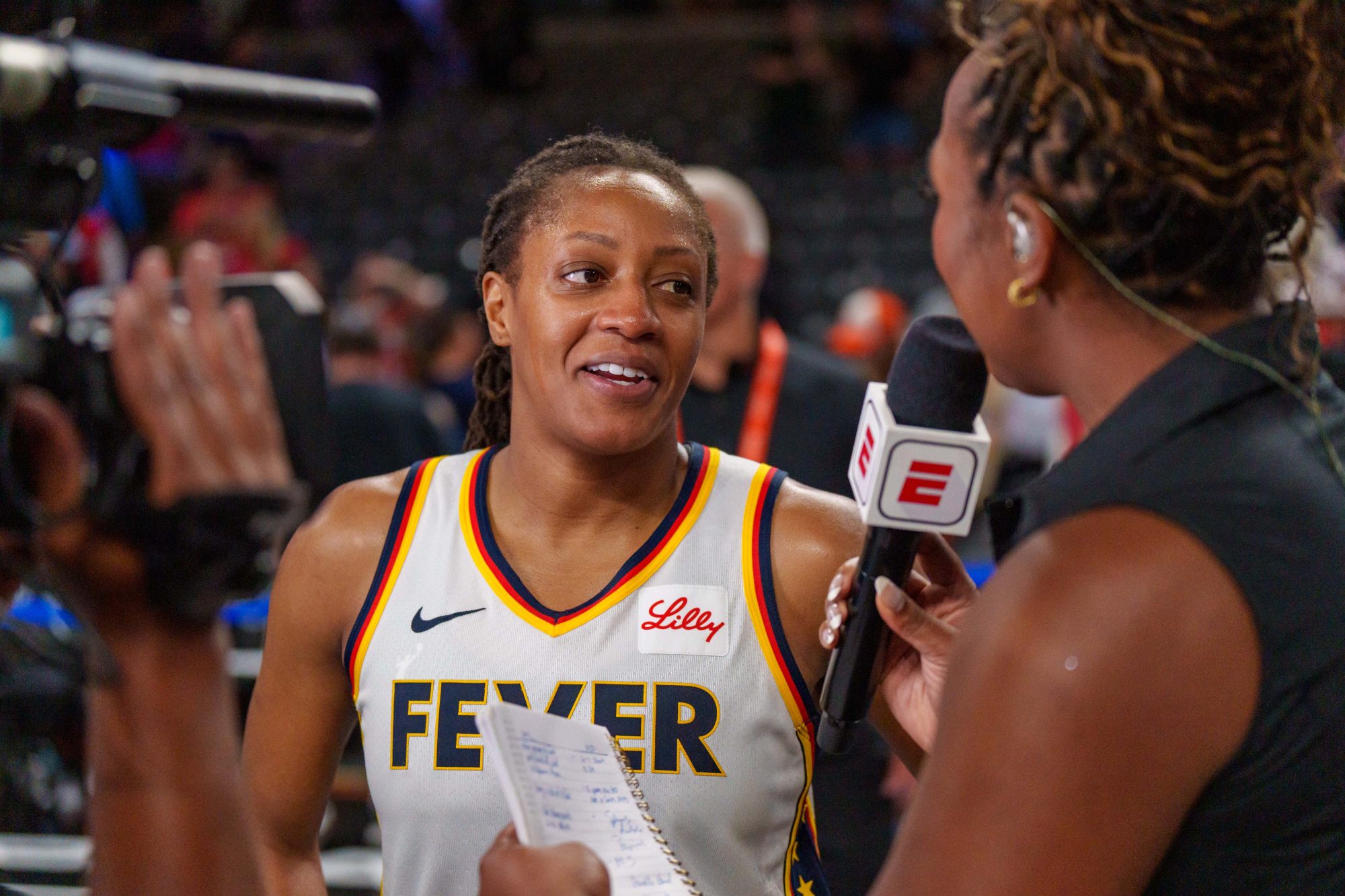 Kelsey Mitchell #0 of the Indiana Fever speaks with ESPN reporter after the game three of the first round of WNBA Playoffs between the Indiana Fever and Atlanta Dream at Gateway Center Arena on September 18, 2025 in College Park, Georgia.