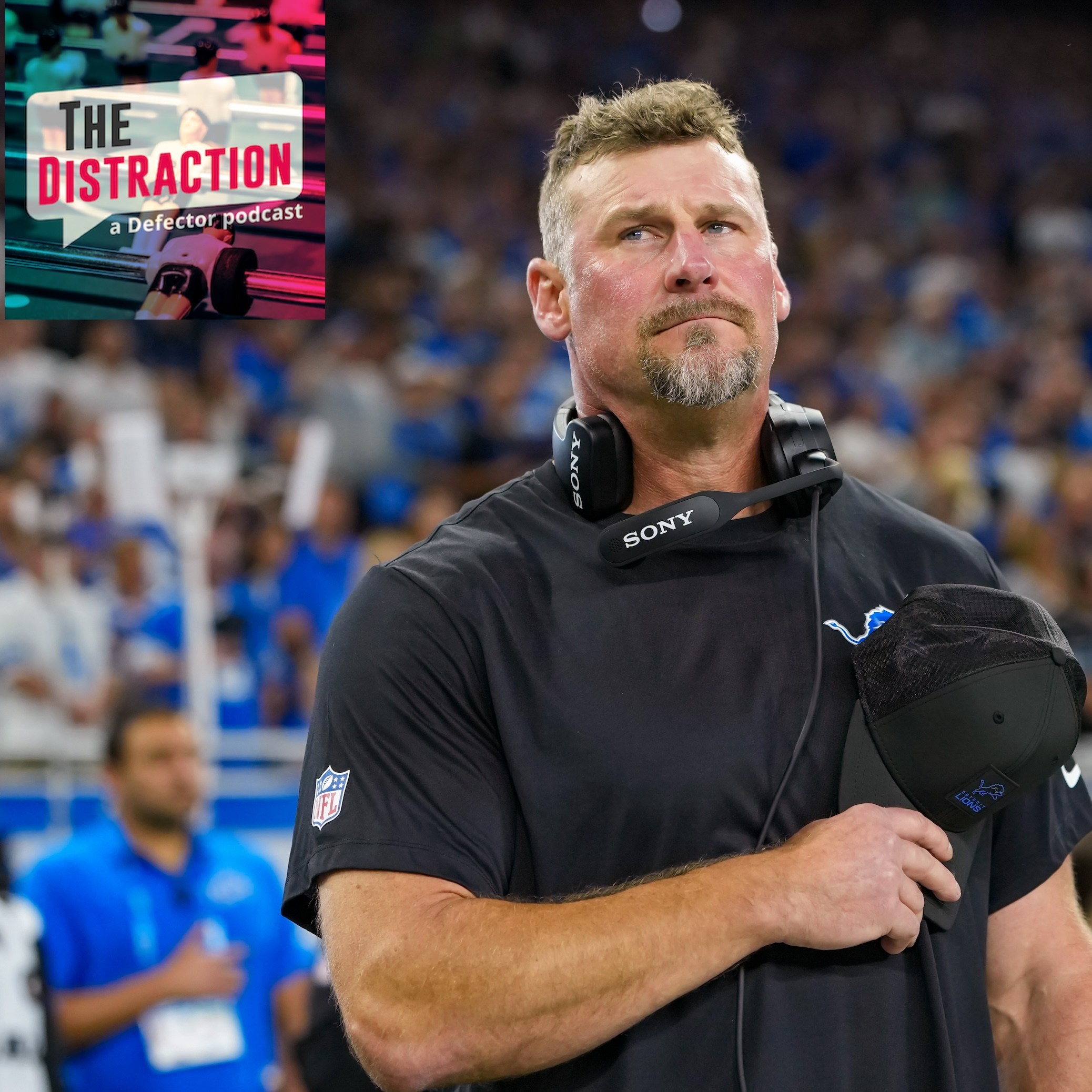 Head coach Dan Campbell of the Detroit Lions looks on prior to an NFL football game against the Chicago Bears at Ford Field on September 14, 2025. The Distraction logo is at upper left.