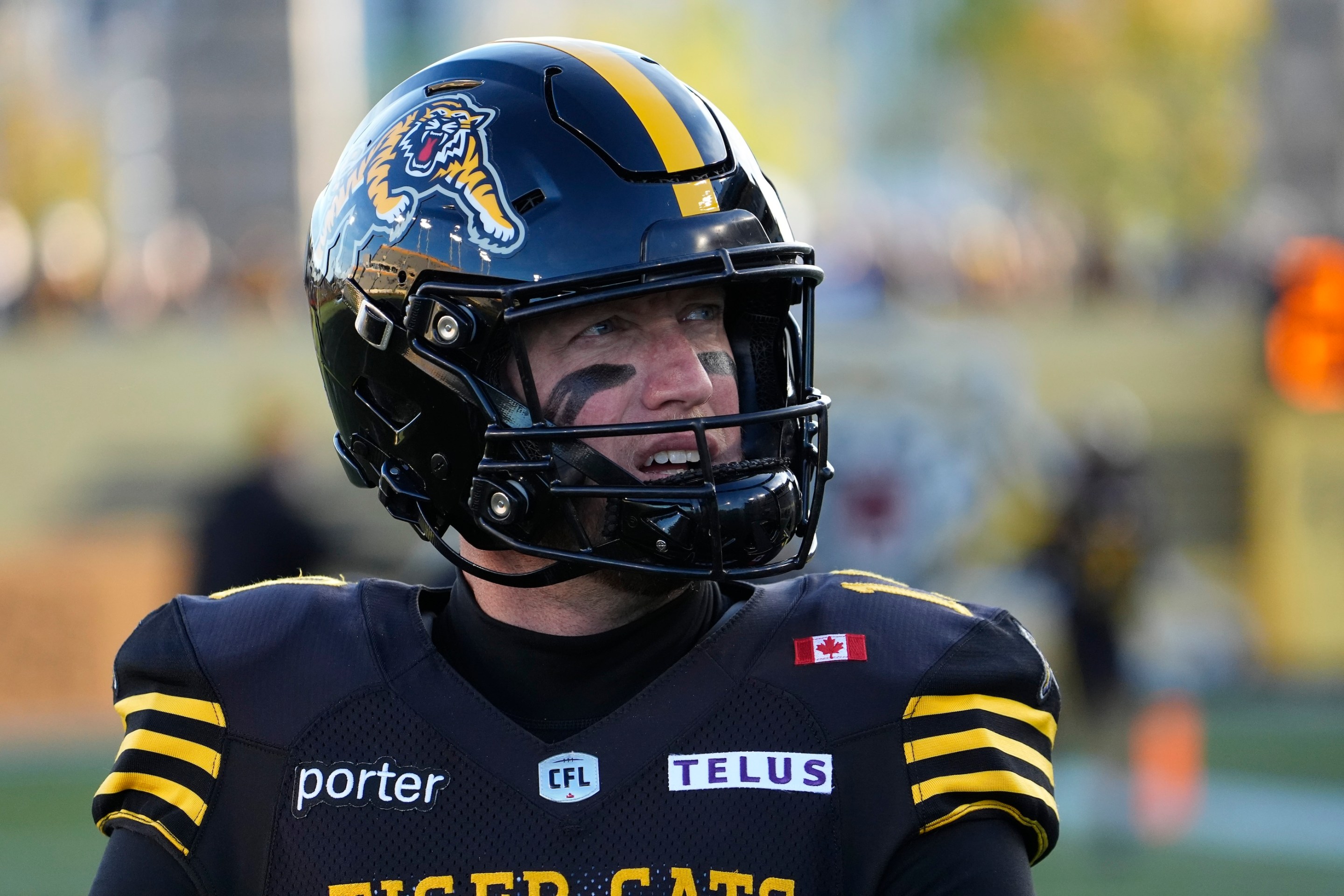 Bo Levi Mitchell #19 of the Hamilton Tiger-Cats looks to the sidelines during warm up before a game against the Edmonton Elks at Hamilton Stadium on September 20, 2025.