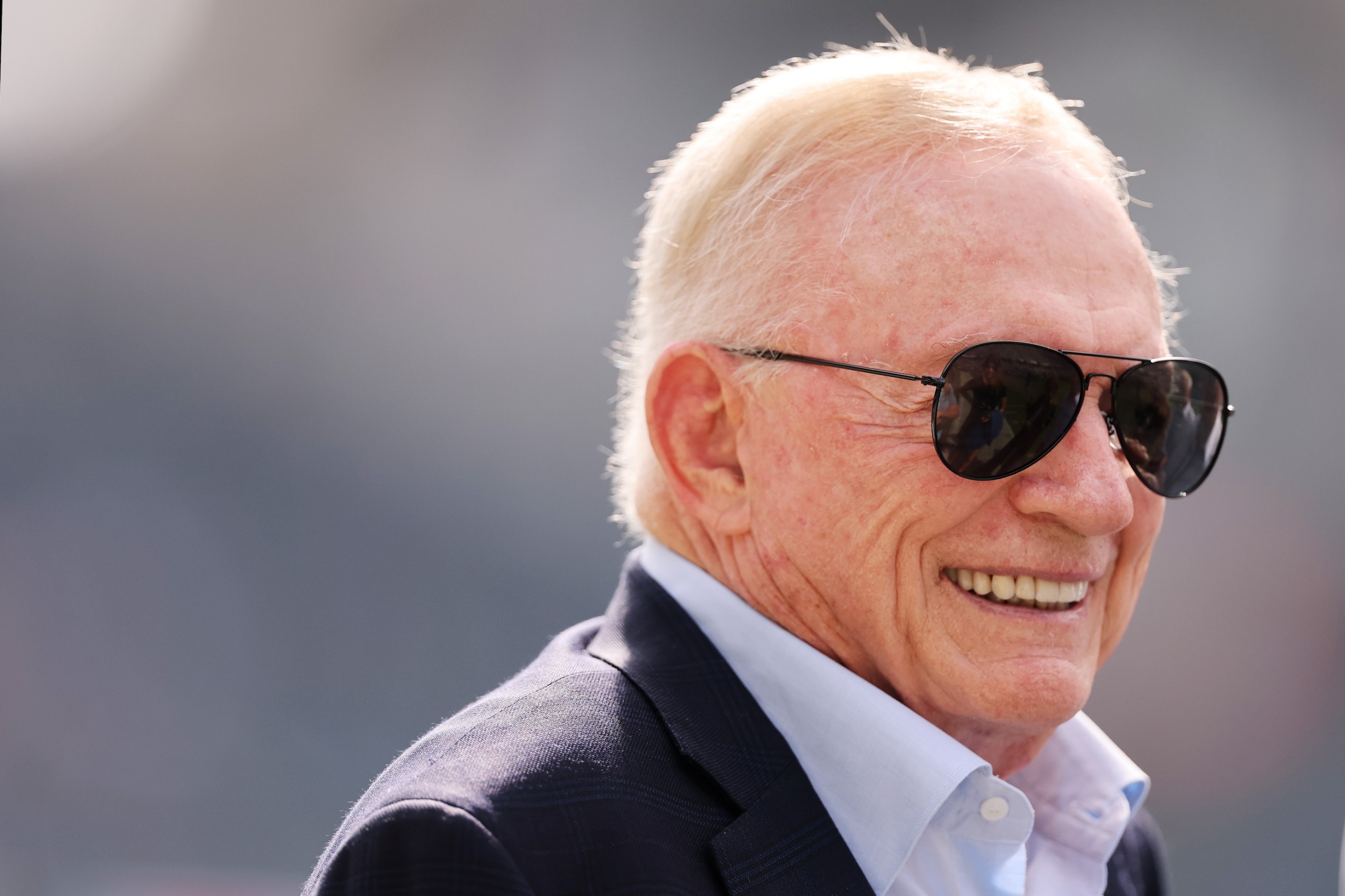 Owner Jerry Jones of the Dallas Cowboys looks on before the game against the Chicago Bears at Soldier Field on September 21, 2025. He has big sunglasses on.