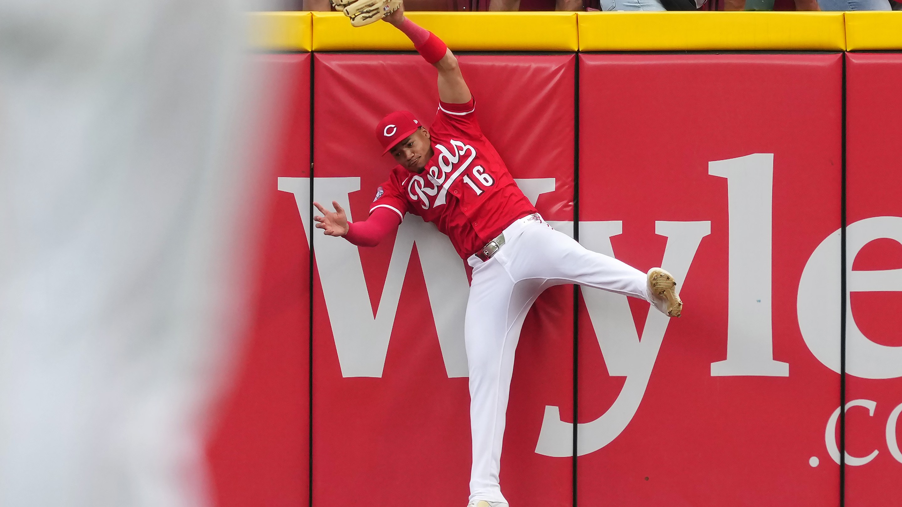 Noelvi Marte #16 of the Cincinnati Reds leaps to make a catch in the ninth inning against the Pittsburgh Pirates