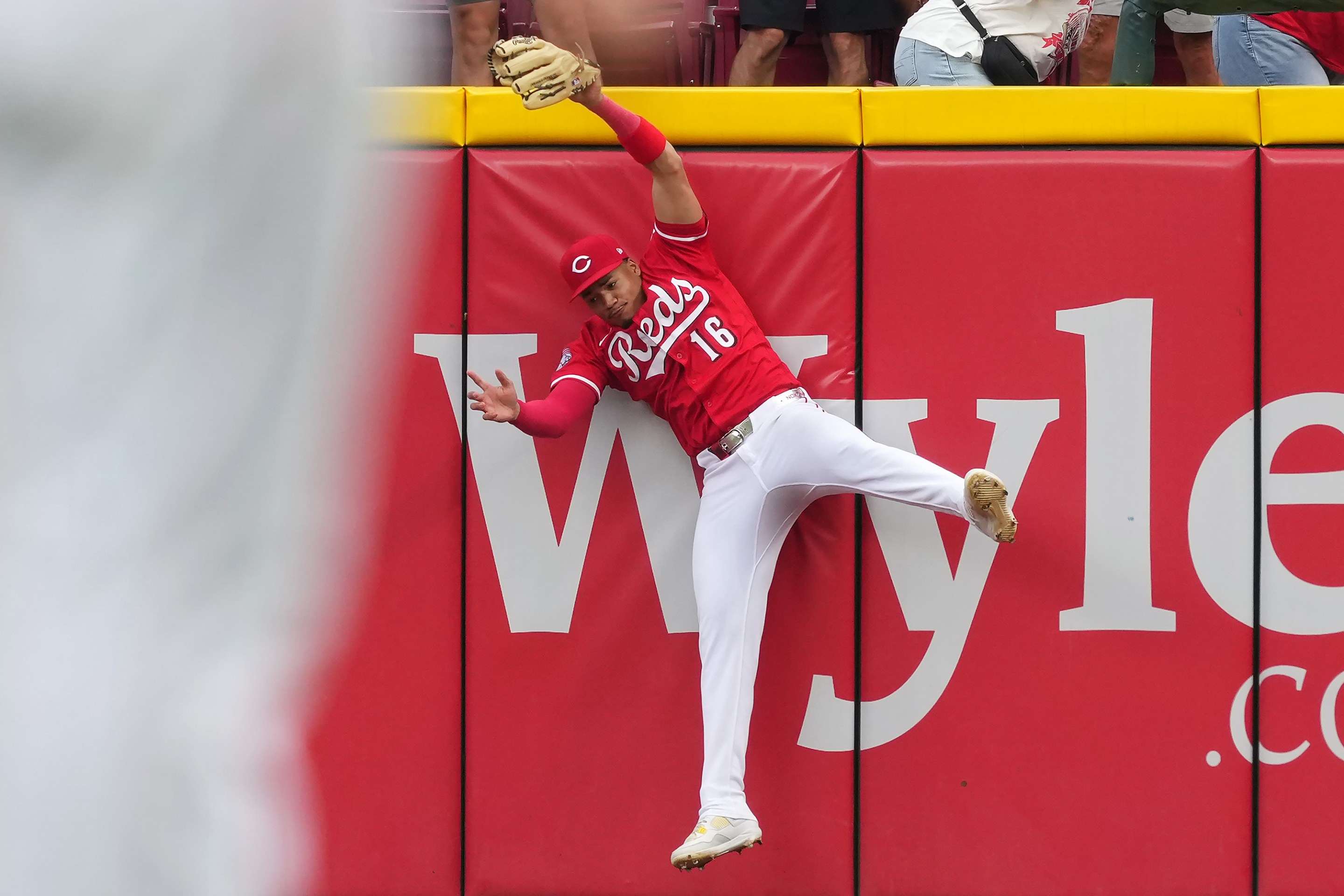 Noelvi Marte #16 of the Cincinnati Reds leaps to make a catch in the ninth inning against the Pittsburgh Pirates