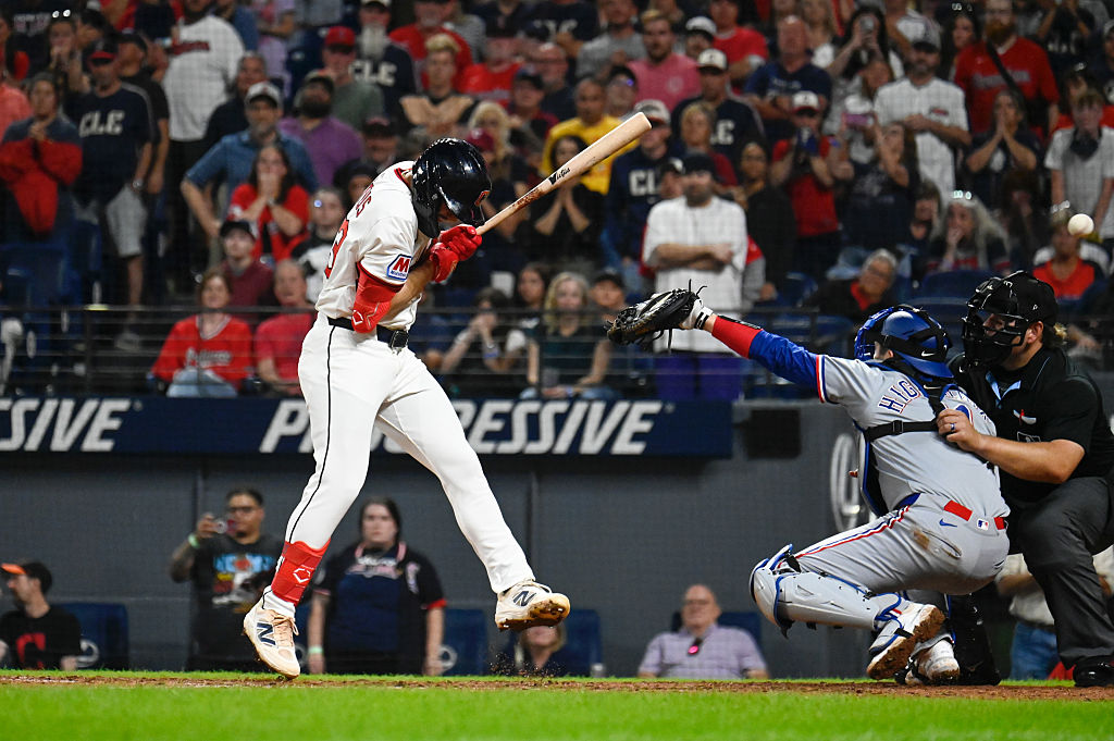 C.J. Kayfus #63 of the Cleveland Guardians is hit by a pitch to force a walk-off to win the game between the Texas Rangers and the Cleveland Guardians at Progressive Field on Saturday, September 27, 2025 in Cleveland, Ohio