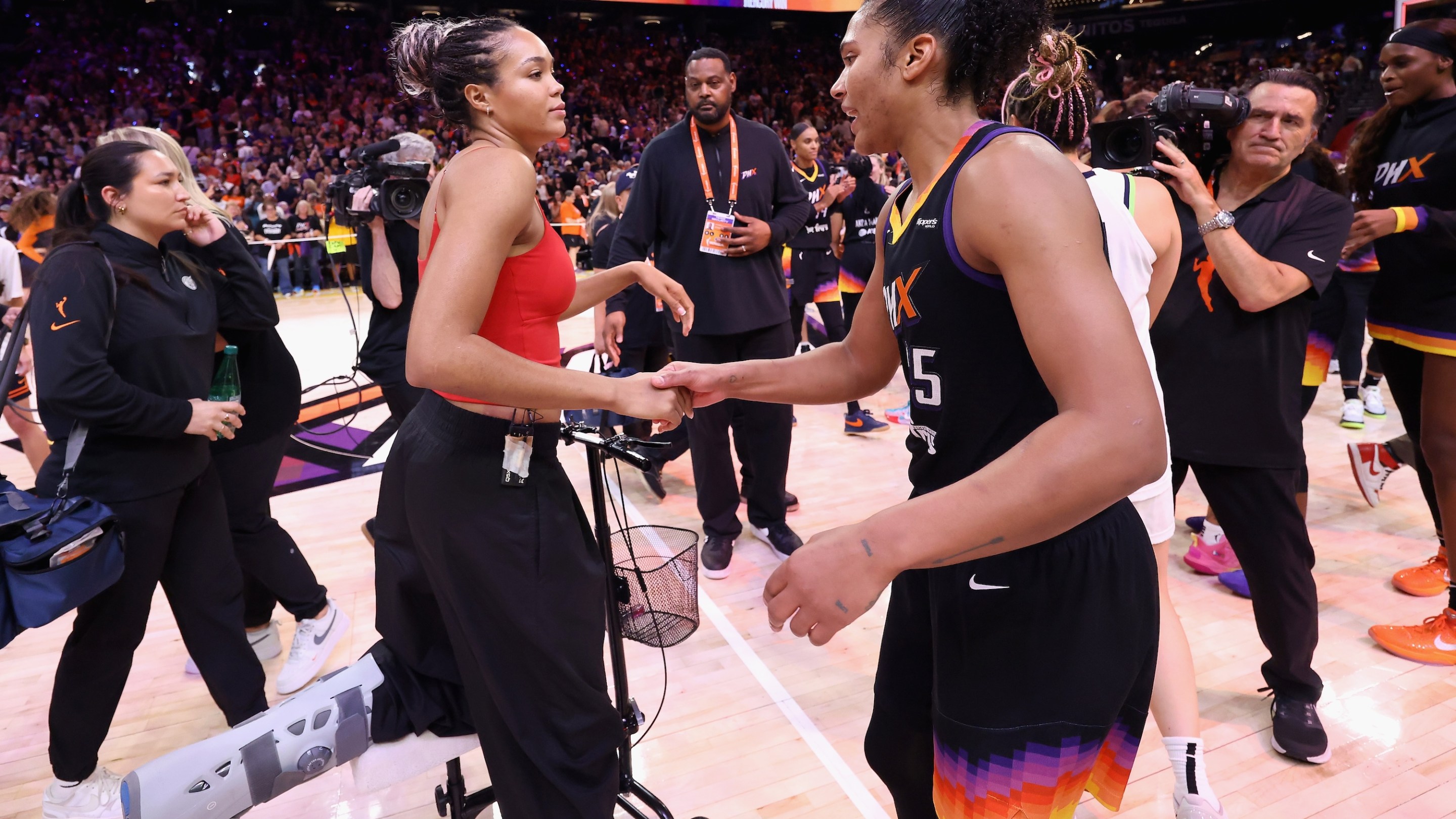 Napheesa Collier #24 of the Minnesota Lynx congratulates Alyssa Thomas #25 of the Phoenix Mercury following Game Four of the 2025 WNBA Playoffs semifinals at PHX Arena on September 28, 2025 in Phoenix, Arizona. The Mercury defeated the Lynx 86-81 to advance to the WNBA finals.