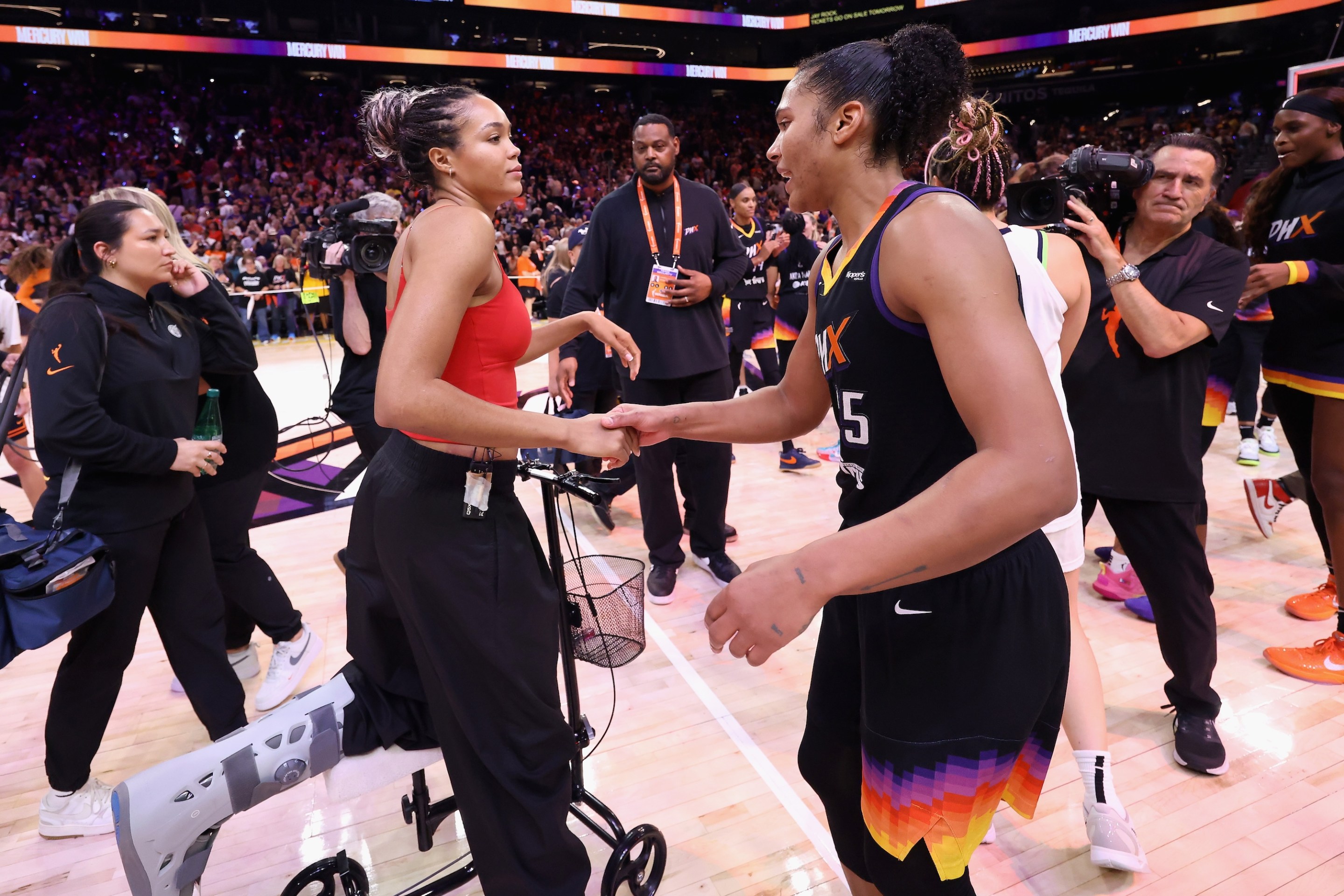 Napheesa Collier #24 of the Minnesota Lynx congratulates Alyssa Thomas #25 of the Phoenix Mercury following Game Four of the 2025 WNBA Playoffs semifinals at PHX Arena on September 28, 2025 in Phoenix, Arizona. The Mercury defeated the Lynx 86-81 to advance to the WNBA finals.