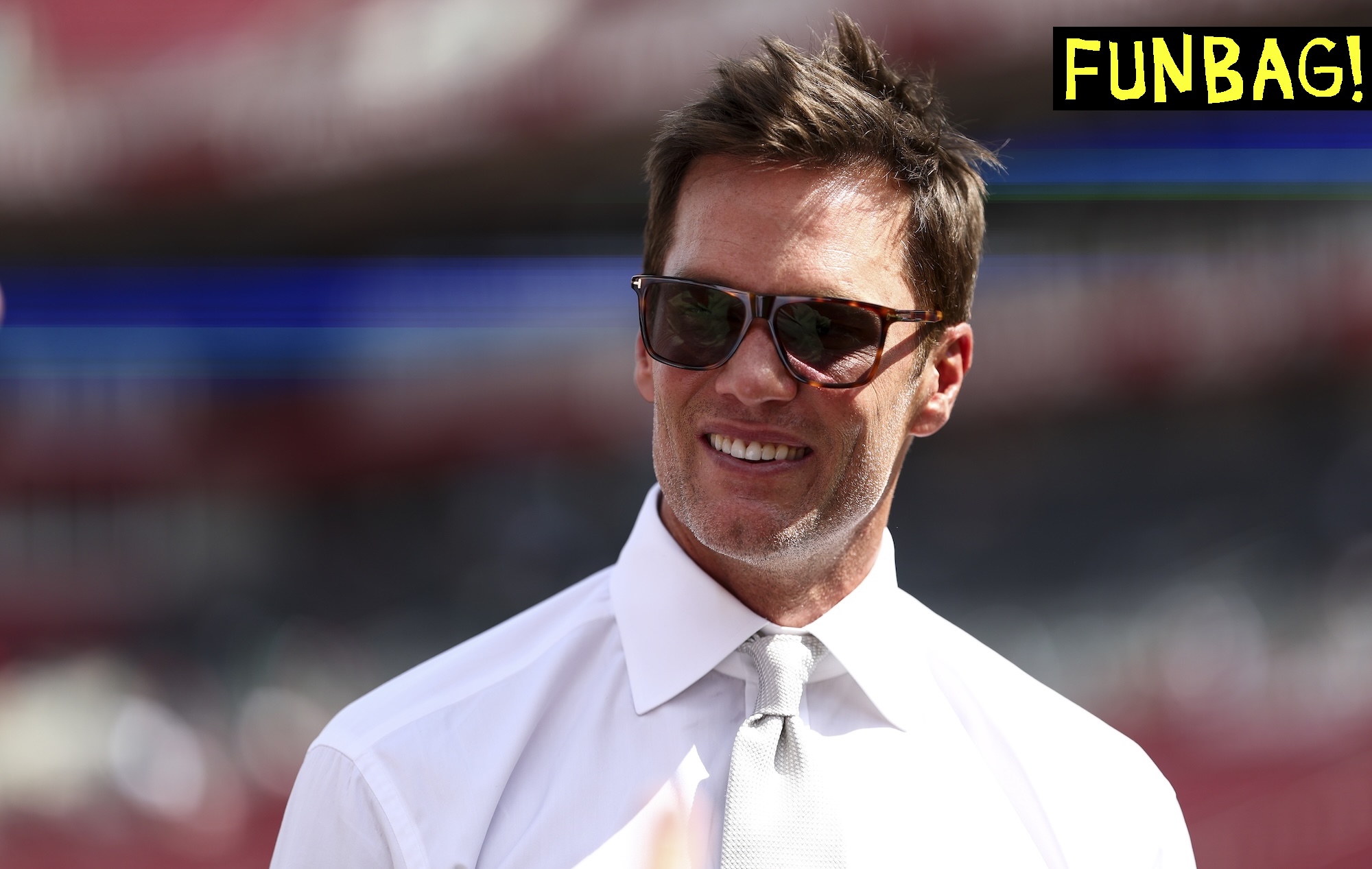 TAMPA, FLORIDA - SEPTEMBER 28: Fox Sports commentator and former NFL quarterback Tom Brady smiles prior to an NFL football game between the Tampa Bay Buccaneers and the Philadelphia Eagles at Raymond James Stadium on September 28, 2025 in Tampa, Florida. (Photo by Kevin Sabitus/Getty Images)