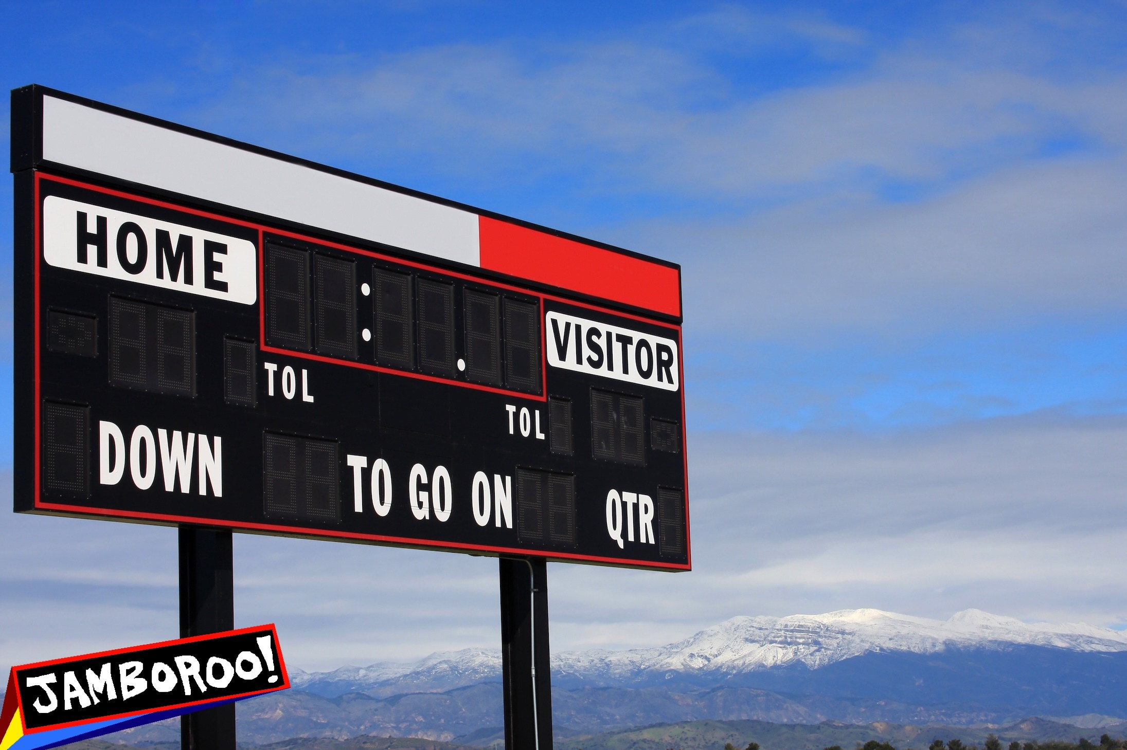 A blank high school scoreboard with a backdrop of the snow-covered Topatopa Mountains in Ventura County, California.
