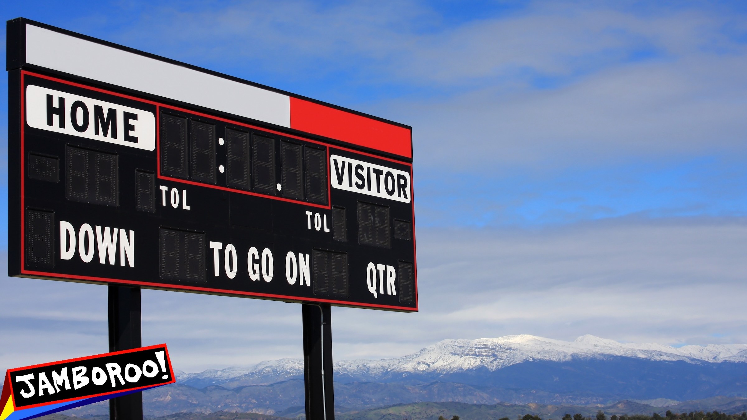 A blank high school scoreboard with a backdrop of the snow-covered Topatopa Mountains in Ventura County, California.