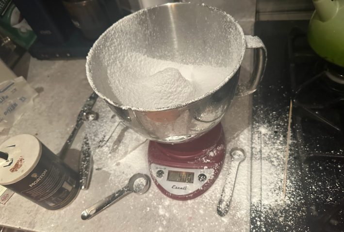 Counter covered in powdered sugar.