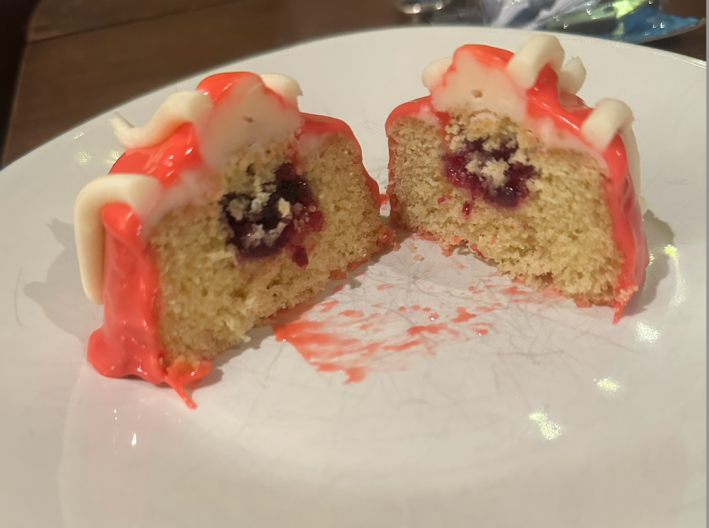 Fancy cut open to reveal cake with jam and buttercream inside