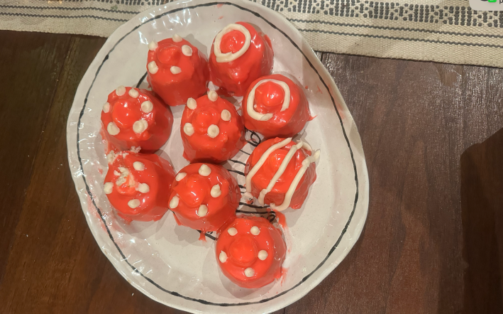 Nine red fancies that look kind of like boobs with bad decoration.