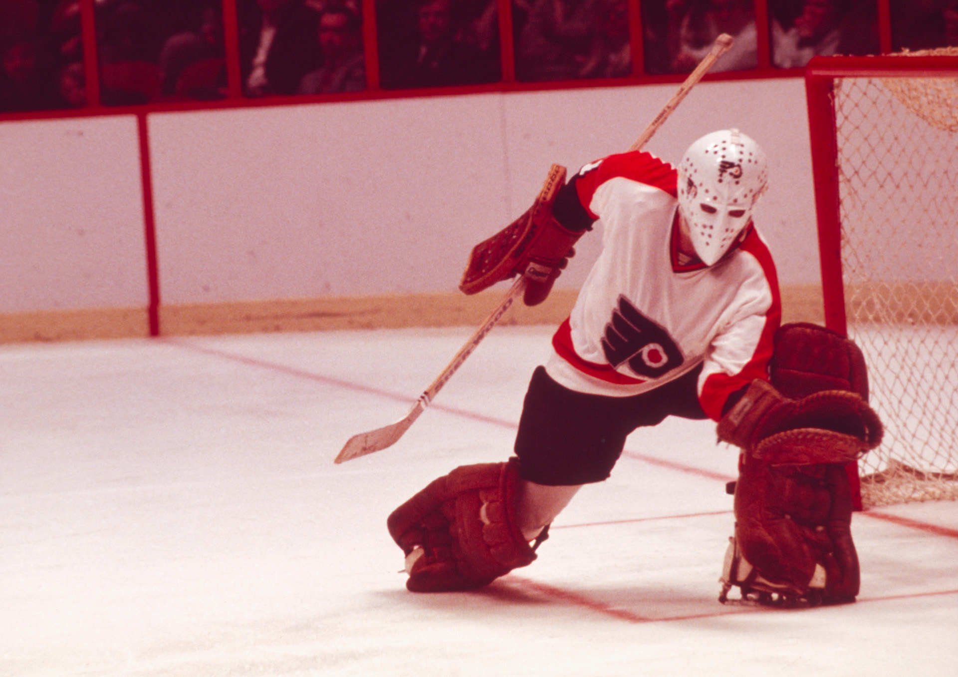 PHILADELPHIA, PENNSYLVANIA - CIRCA 1975: Goalie Bernie Parent #1 of the Philadelphia Flyers guards the net during a game against the New York Rangers circa 1975 at the Spectrum in Philadelphia, Pennsylvania. Parent helped the Flyers to two Stanley Cup Championships in 1974 and 1975.