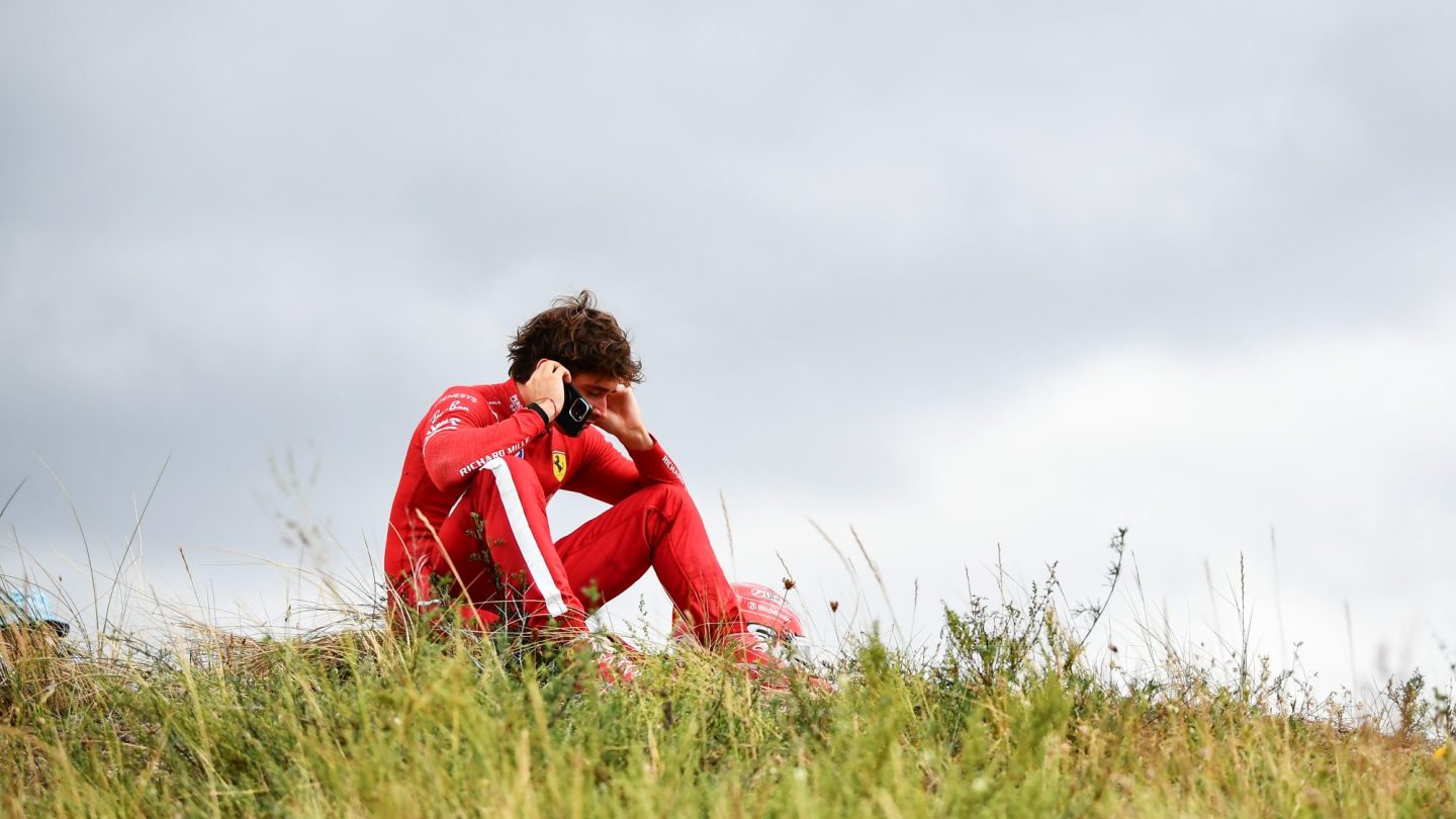 Charles Leclerc of Monaco and Scuderia Ferrari looks on from the dunes after crashing out of the race.