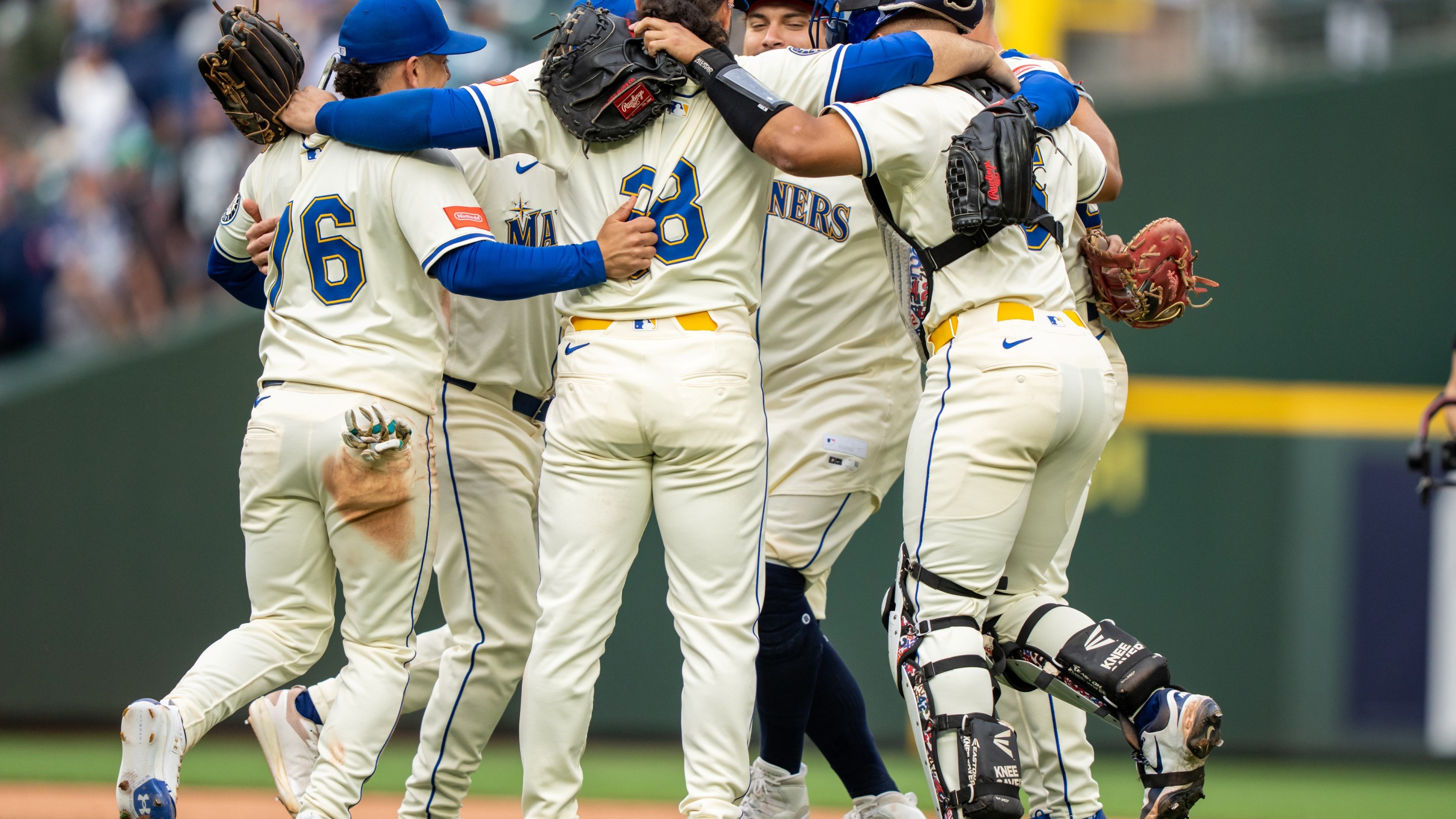 Seattle Mariners (L-R) Leo Rivas #76, Eugenio Suarez #28, Josh Naylor #12 and Harry Ford #5 at T-Mobile Park on September 14, 2025 in Seattle, Washington.