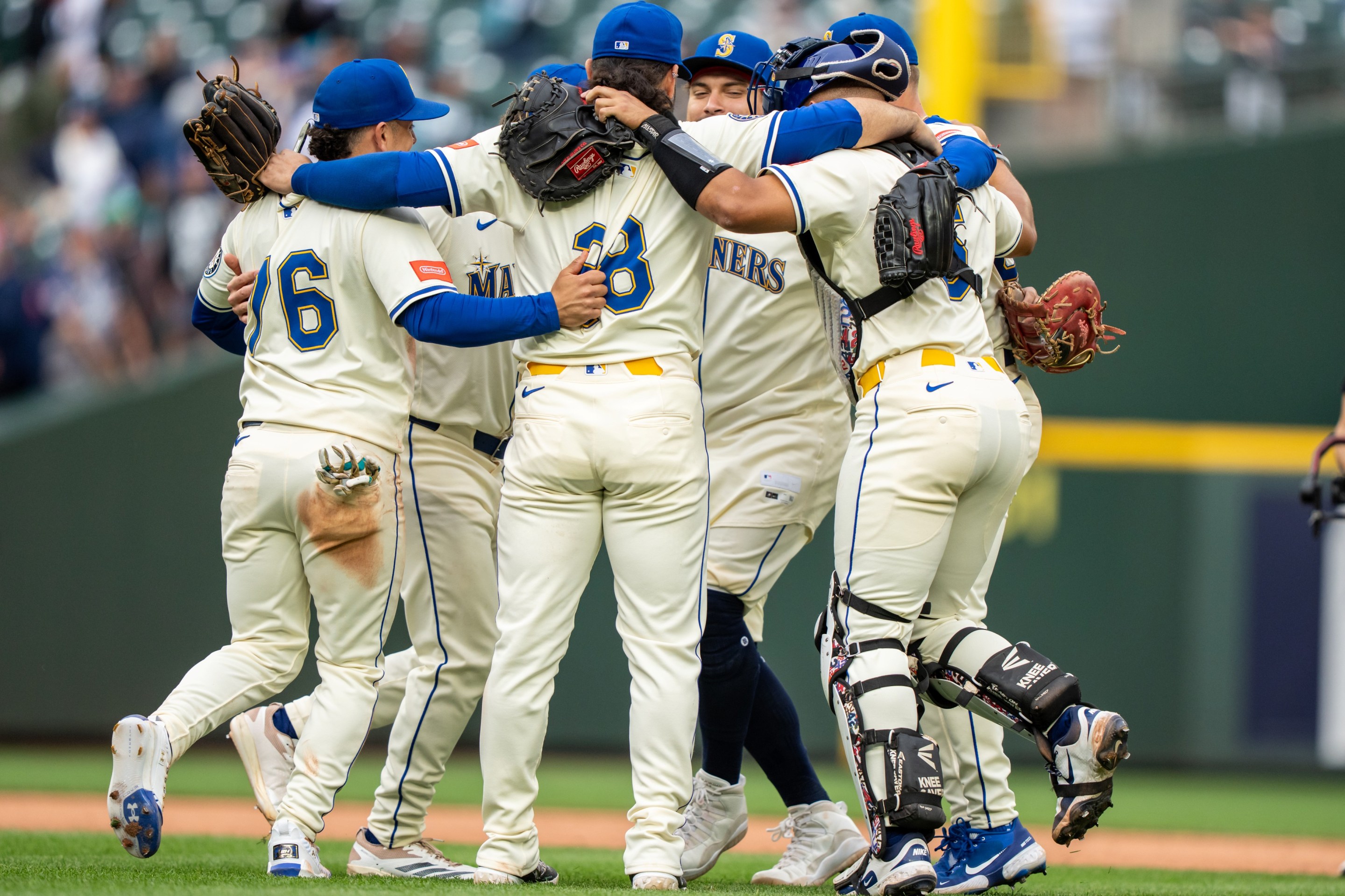 Seattle Mariners (L-R) Leo Rivas #76, Eugenio Suarez #28, Josh Naylor #12 and Harry Ford #5 at T-Mobile Park on September 14, 2025 in Seattle, Washington.