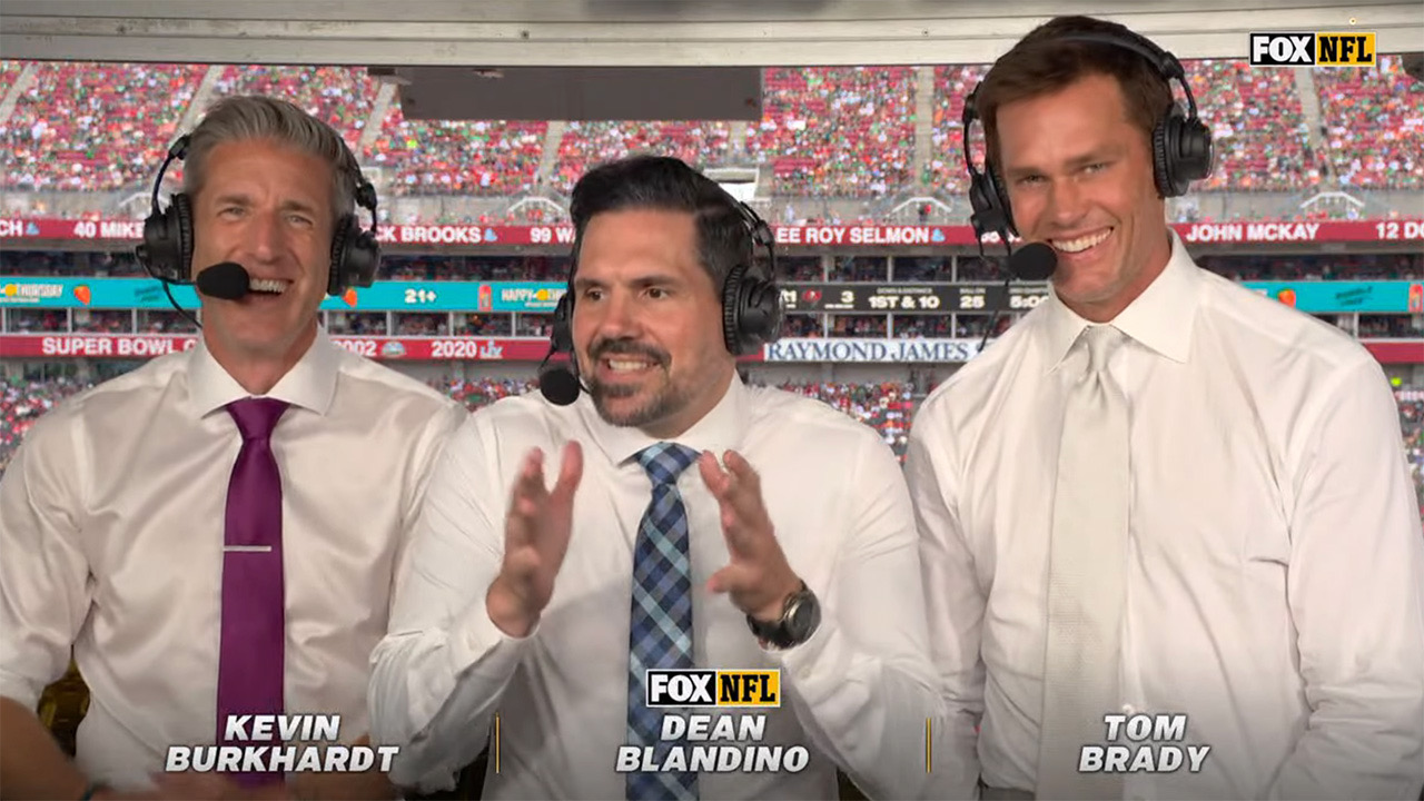 Tom Brady wearing white-on-white tie and shirt combo in the broadcast booth and sort of looking like a caterer.