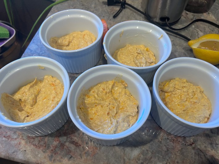 Batter divided into five molds.