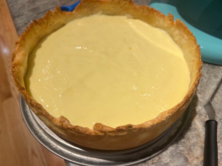 Wet, loose lemon curd inside the tart crust.