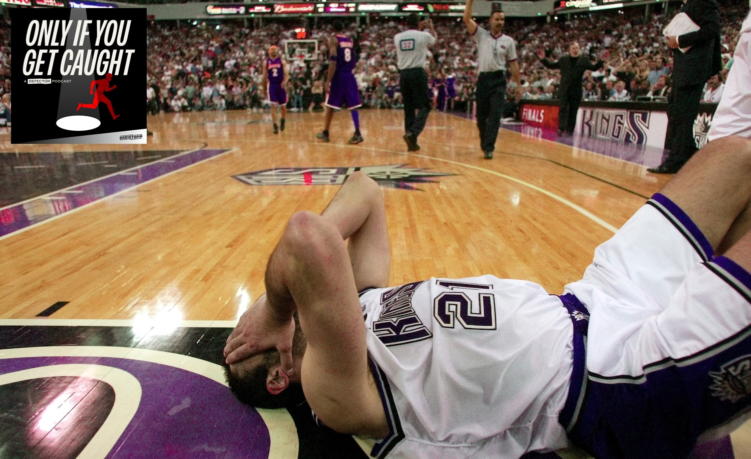 KINGS03E-C-03JUN02-SP-CG --- Kings's Vlade Divac, lays on the floor as he fouls out in the final minutes of regulation. The Kings lost to the Los Angeles Lakers in the final seconds of overtime at ARCO Arena in Sacramento, Ca. The Sacramento Kings played the Los Angeles Lakers in Game 7 of the NBA Western Conference Finals at Arco Arena in Sacramento, Ca., on Tuesday, May 28, 2002.