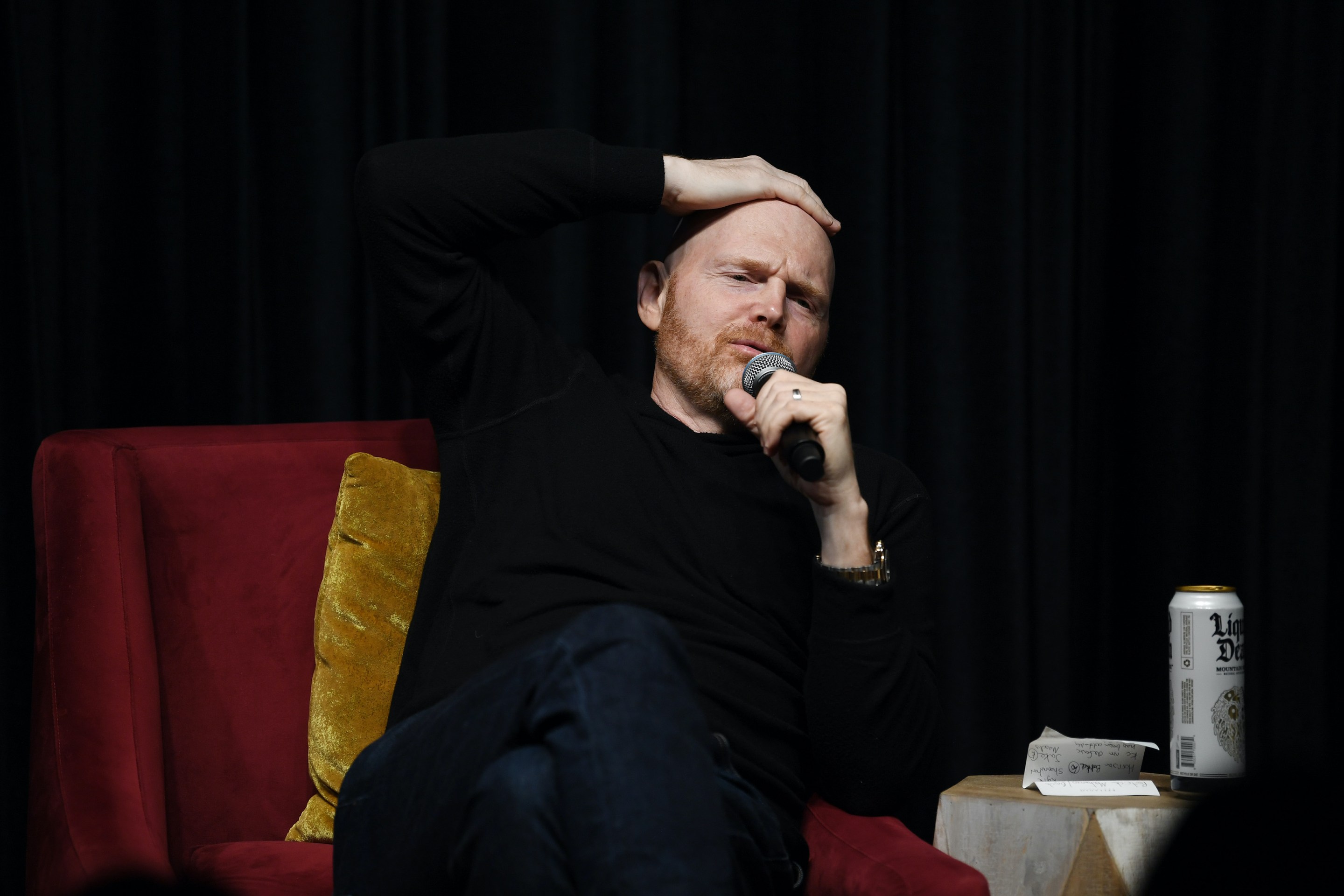 Bill Burr talks on stage.