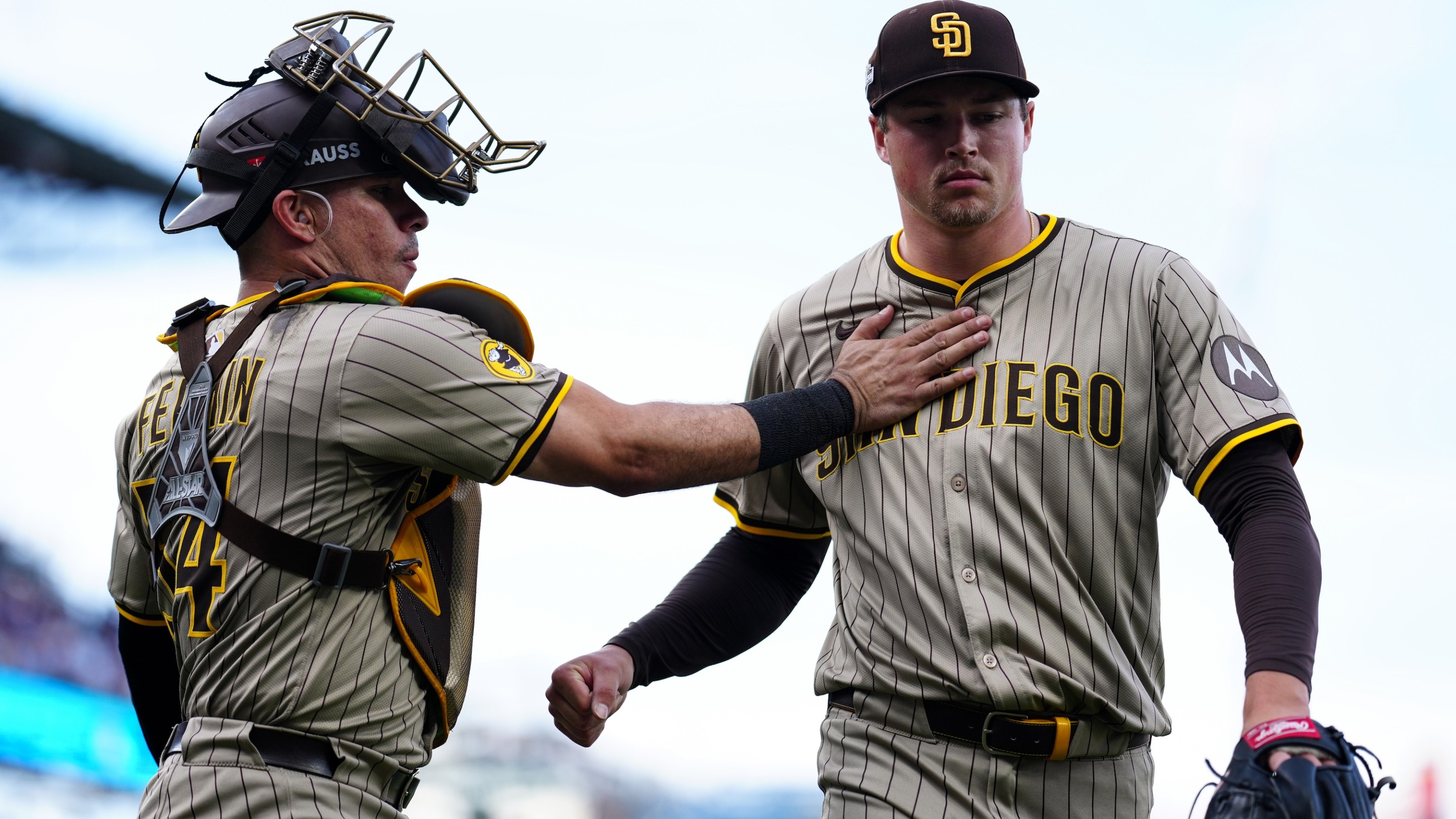 CHICAGO, IL - OCTOBER 01: Freddy Fermin #54 and Mason Miller #22 of the San Diego Padres interact during Game Two of the National League Wild Card Series between the San Diego Padres and the Chicago Cubs at Wrigley Field on Wednesday, October 1, 2025 in Chicago, Illinois. (Photo by Mary DeCicco/MLB Photos via Getty Images)