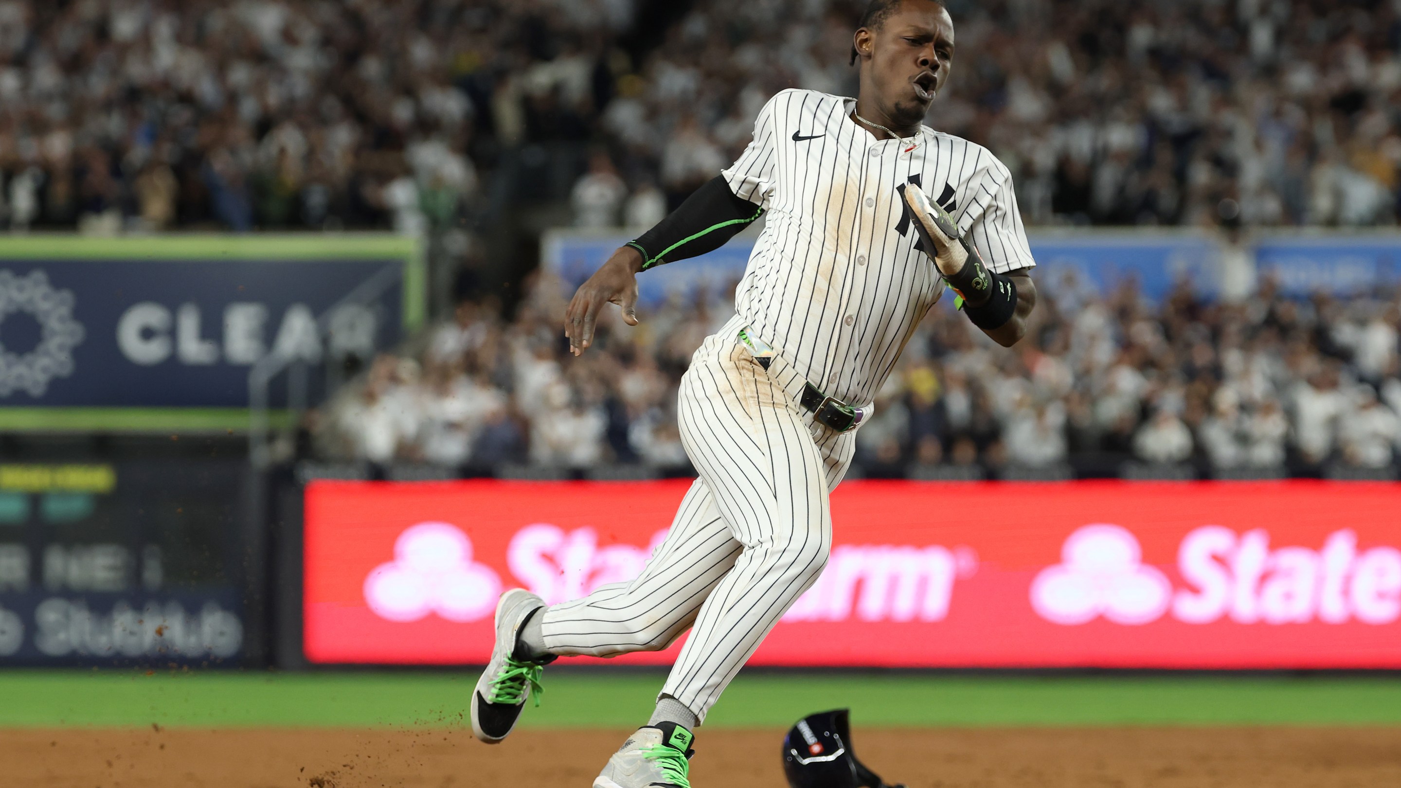 Jazz Chisholm Jr. #13 of the New York Yankees rounds third base to score a go-ahead run