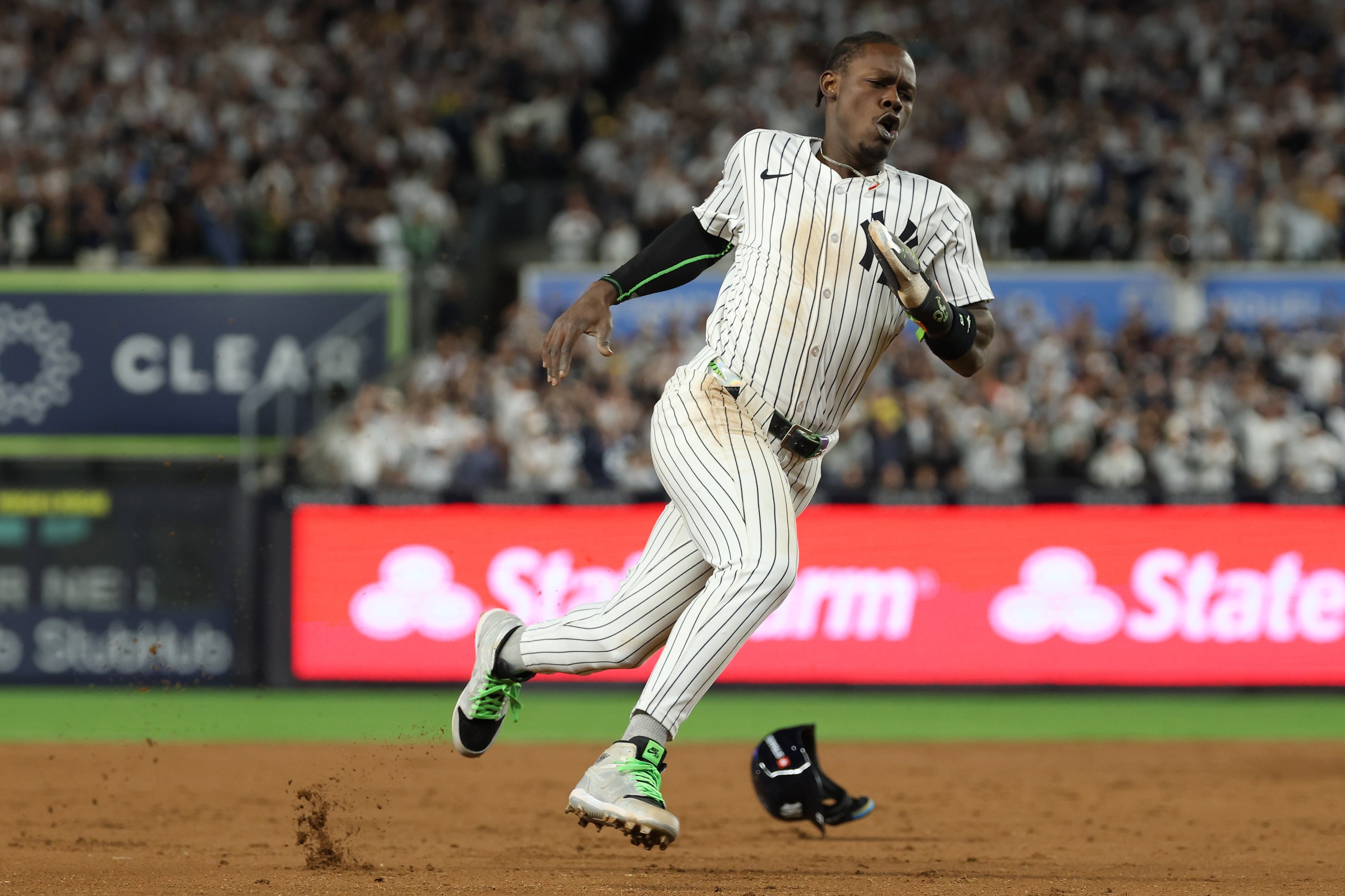 Jazz Chisholm Jr. #13 of the New York Yankees rounds third base to score a go-ahead run