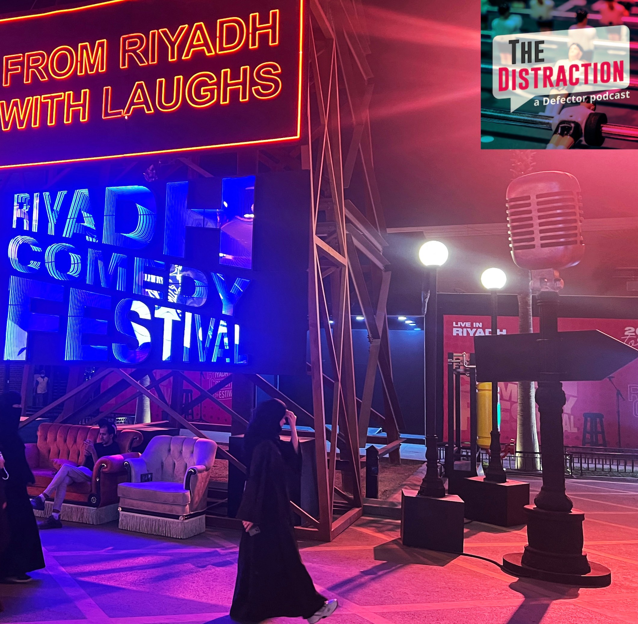 People walk past an installation showcasing the Riyadh Comedy Festival at Boulevard City in the Hittin neighborhood of Riyadh on October 6, 2025. The Distraction logo is at upper right.