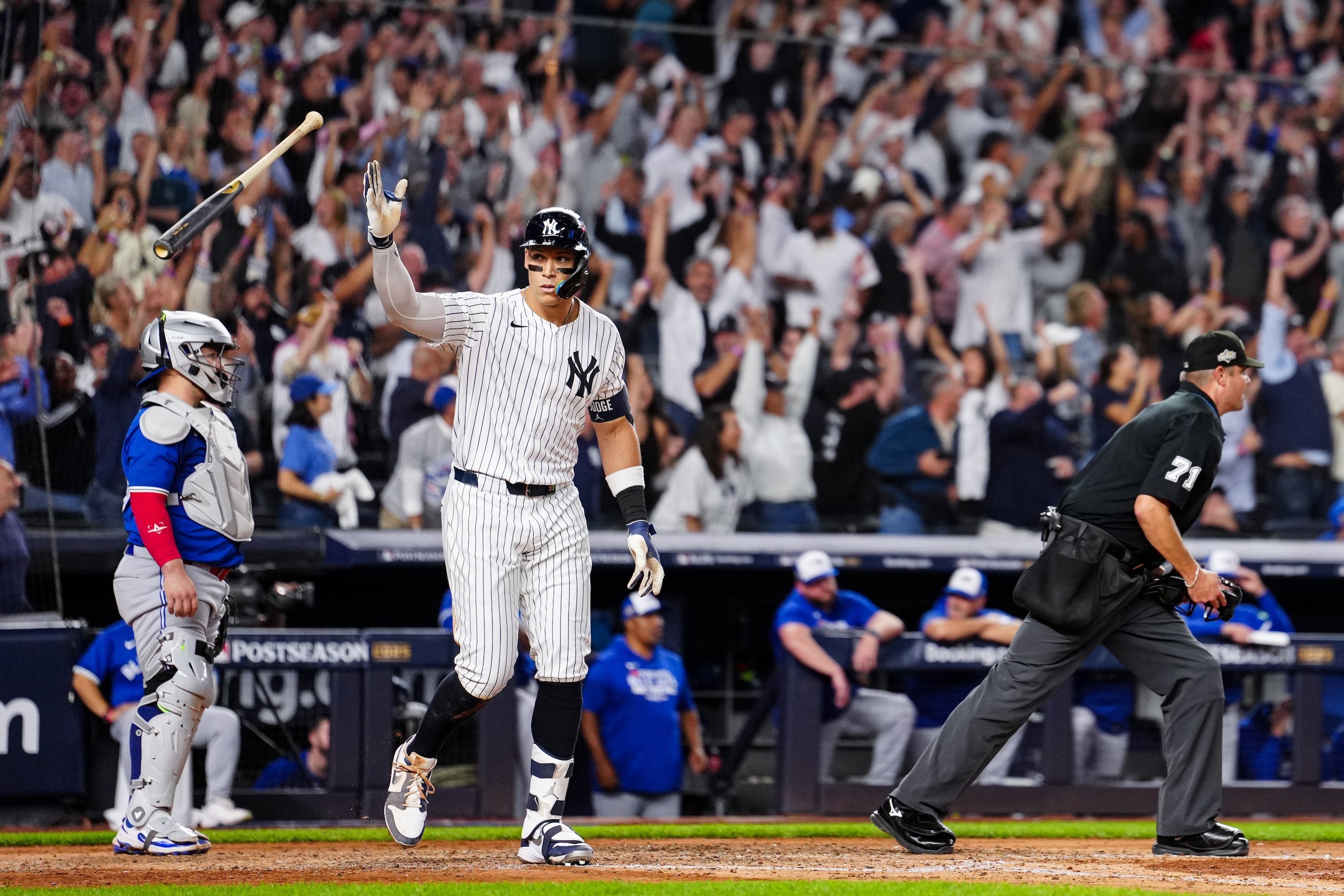 NEW YORK, NY - OCTOBER 07: Aaron Judge #99 of the New York Yankees hits a game-tying three-run home run in the fourth inning of Game Three of the American League Division Series presented by Booking.com between the Toronto Blue Jays and the New York Yankees at Yankee Stadium on Tuesday, October 7, 2025 in New York, New York. (Photo by Daniel Shirey/MLB Photos via Getty Images)