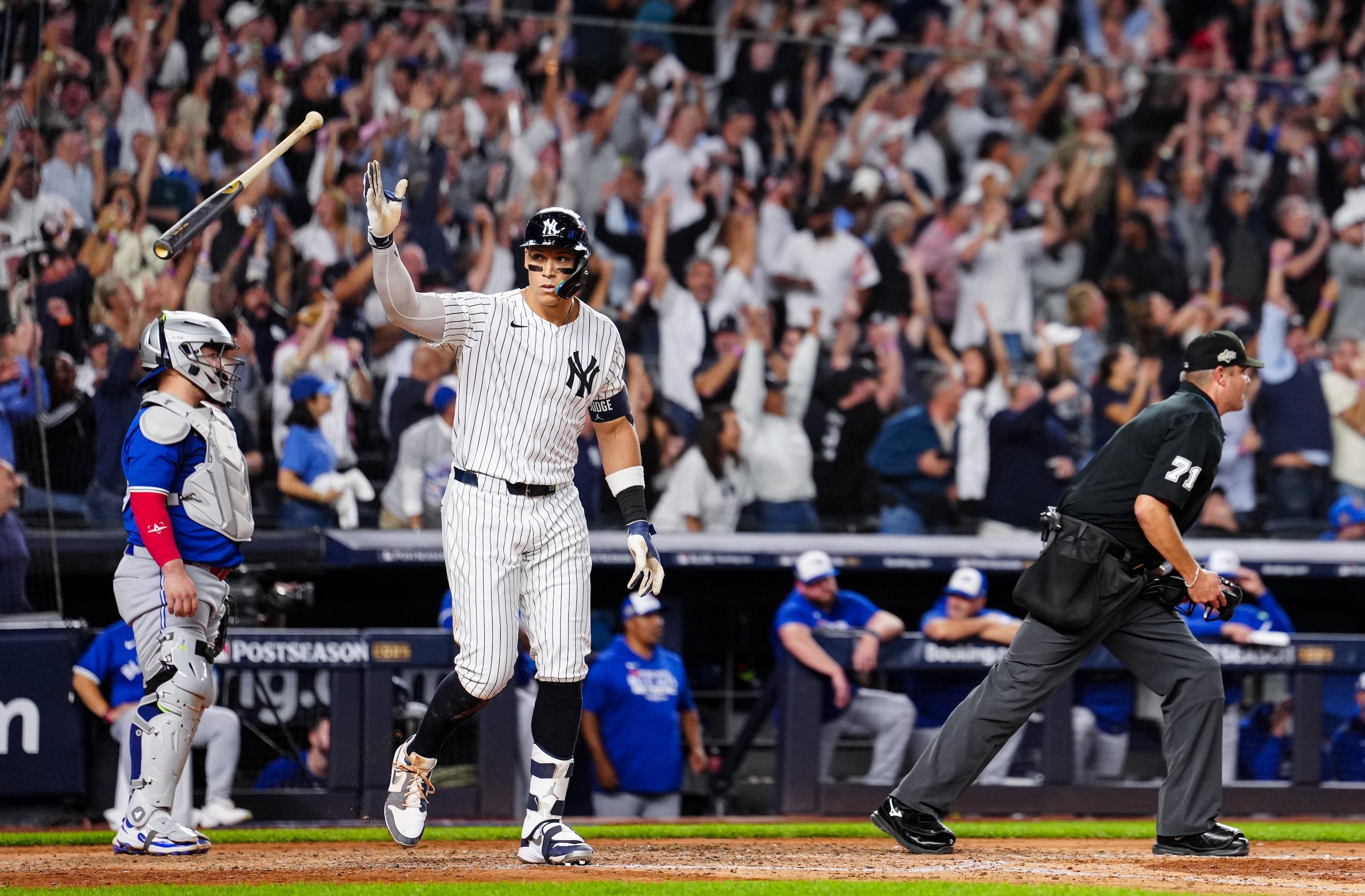 NEW YORK, NY - OCTOBER 07: Aaron Judge #99 of the New York Yankees hits a game-tying three-run home run in the fourth inning of Game Three of the American League Division Series presented by Booking.com between the Toronto Blue Jays and the New York Yankees at Yankee Stadium on Tuesday, October 7, 2025 in New York, New York. (Photo by Daniel Shirey/MLB Photos via Getty Images)