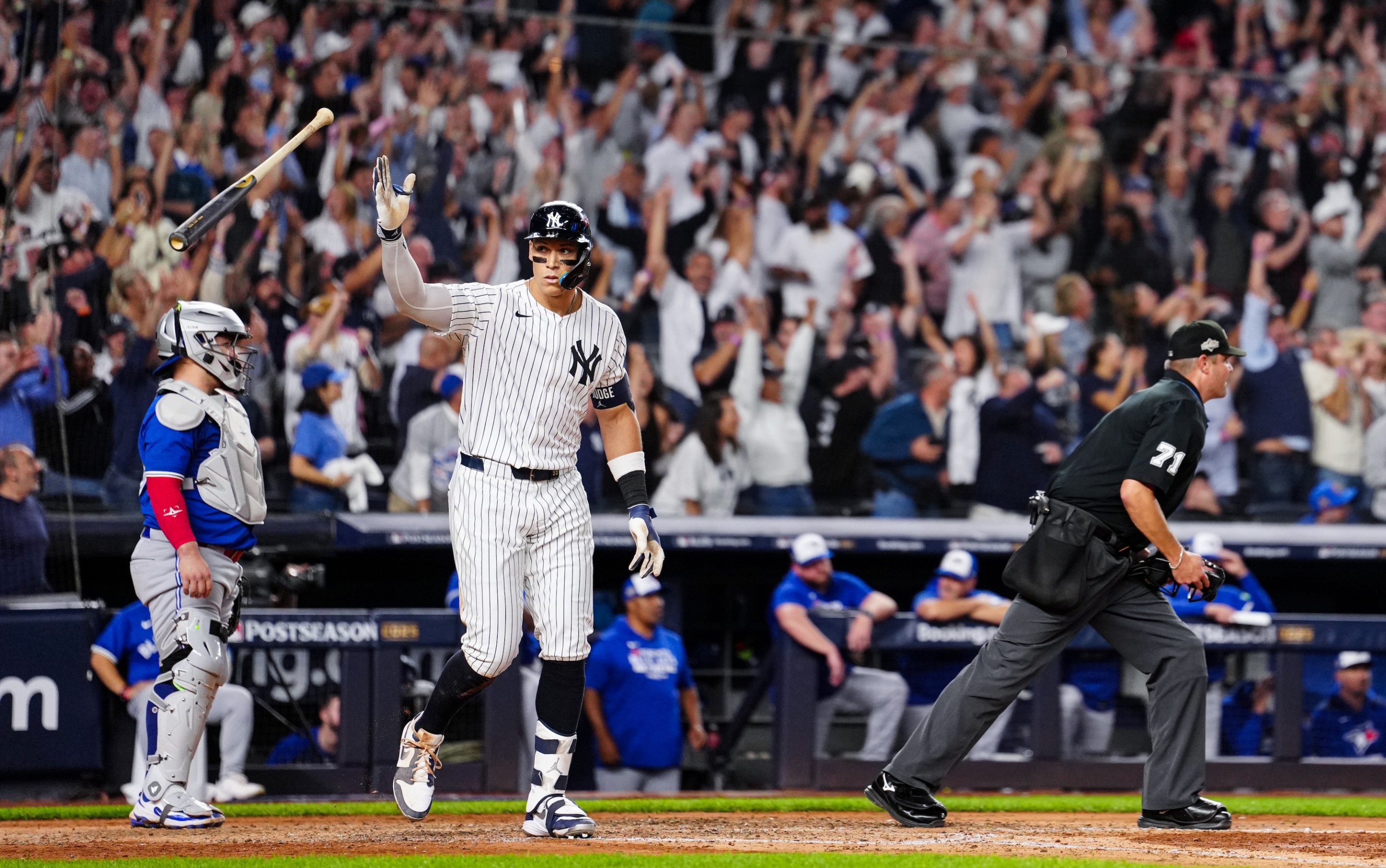 NEW YORK, NY - OCTOBER 07: Aaron Judge #99 of the New York Yankees hits a game-tying three-run home run in the fourth inning of Game Three of the American League Division Series presented by Booking.com between the Toronto Blue Jays and the New York Yankees at Yankee Stadium on Tuesday, October 7, 2025 in New York, New York. (Photo by Daniel Shirey/MLB Photos via Getty Images)