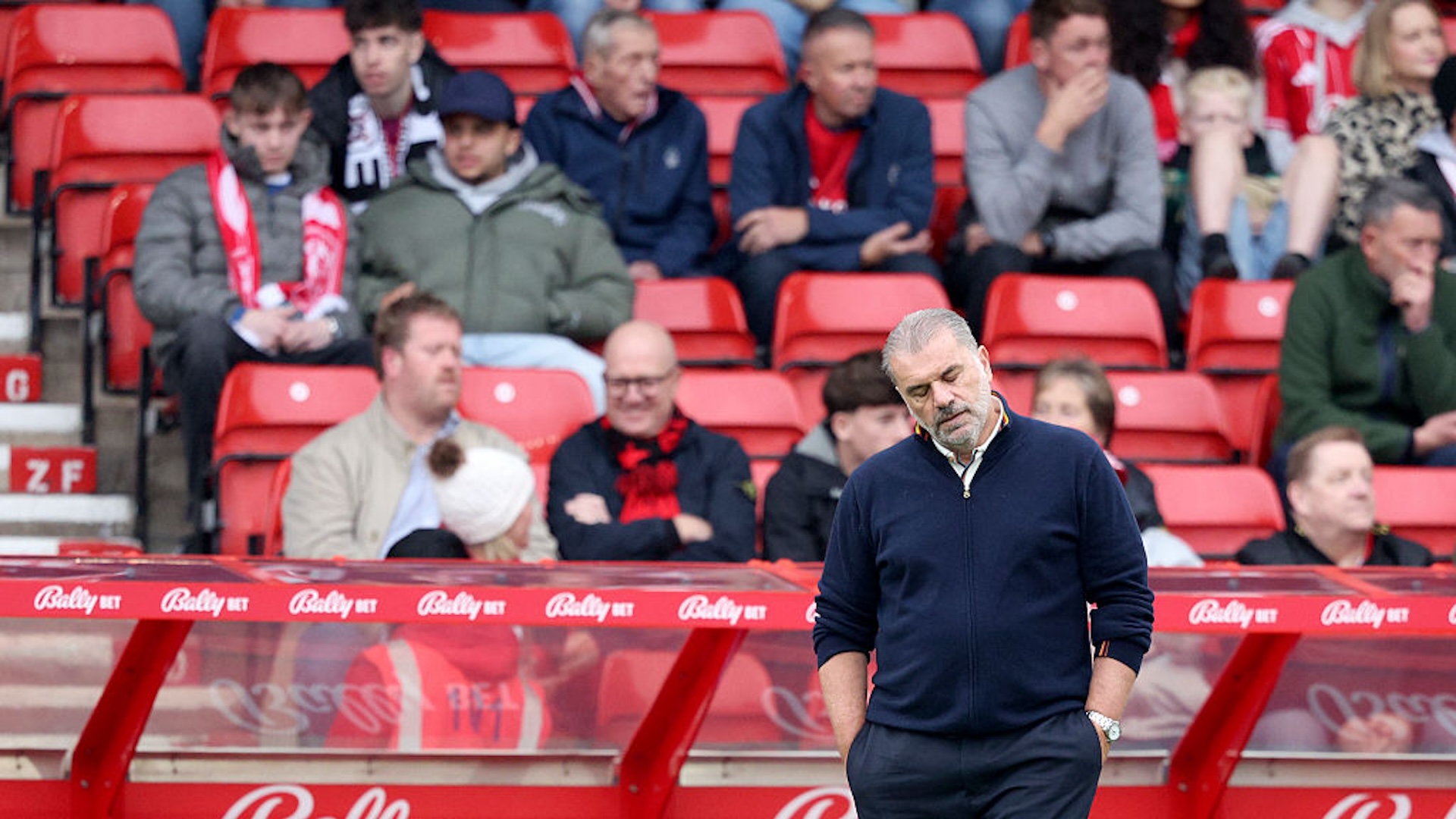 Ange Postecoglou Head Coach of Nottingham Forest looks dejected with empty seats behind during the Premier League match between Nottingham Forest and Chelsea at City Ground on October 18, 2025 in Nottingham, England.