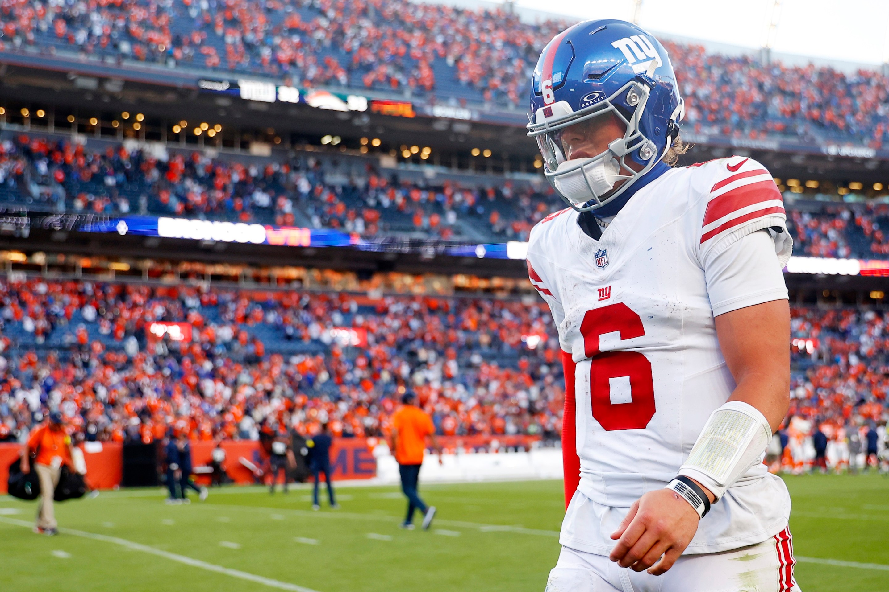 DENVER, COLORADO - OCTOBER 19: Jaxson Dart #6 of the New York Giants walks off the field after his team's 33-32 loss against the Denver Broncos at Empower Field At Mile High on October 19, 2025 in Denver, Colorado. (Photo by Justin Edmonds/Getty Images)