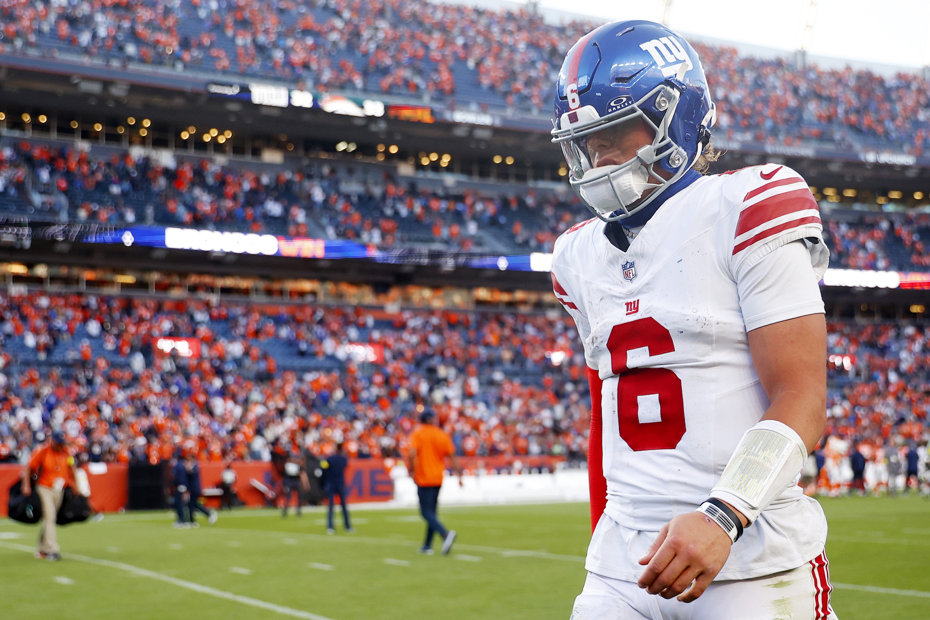 DENVER, COLORADO - OCTOBER 19: Jaxson Dart #6 of the New York Giants walks off the field after his team's 33-32 loss against the Denver Broncos at Empower Field At Mile High on October 19, 2025 in Denver, Colorado. (Photo by Justin Edmonds/Getty Images)